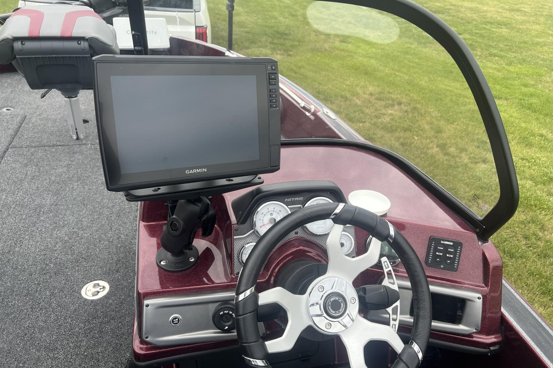 Steering console of 2026 Nitro ZV21 Pro boat with Garmin display and modern controls.