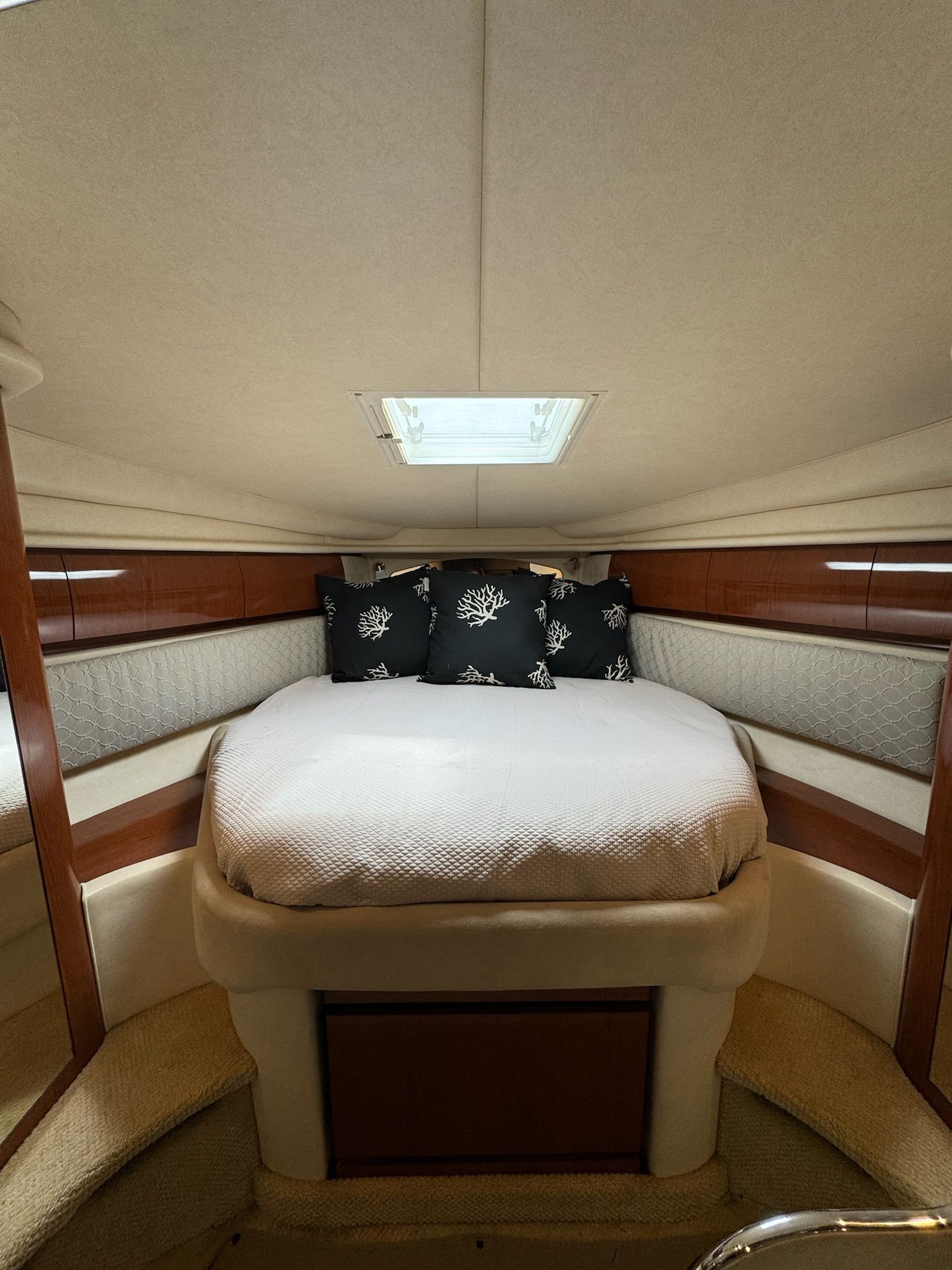 Interior of 2002 Sea Ray 360 Sundancer with cozy bed.