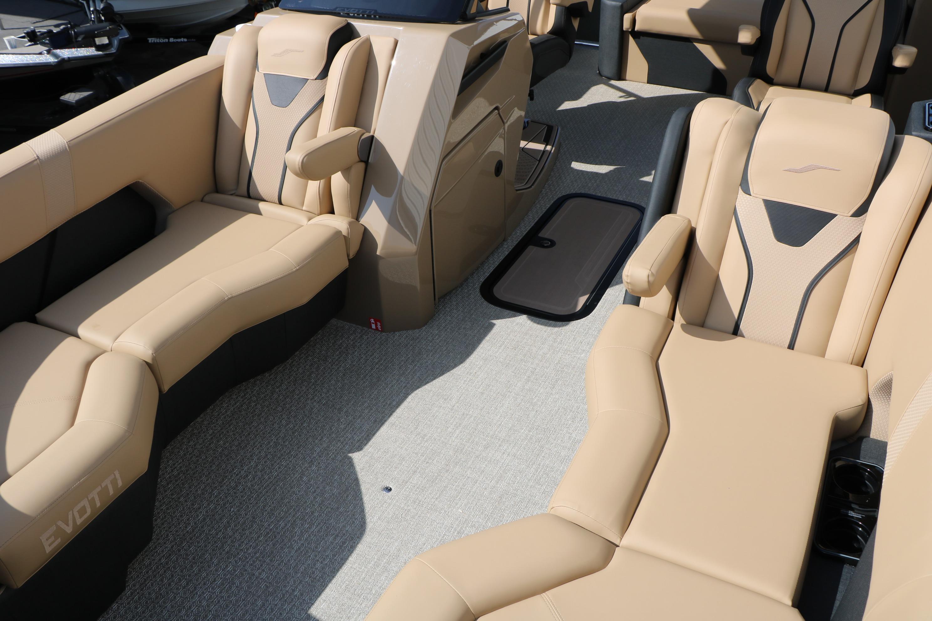 Luxurious interior of 2026 Evotti 723CS boat with beige seating and modern design.