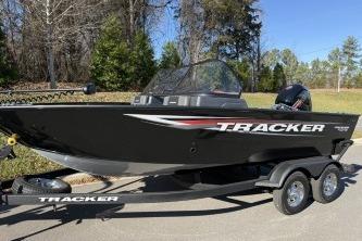 2026 Tracker Pro Guide V-175 Combo boat on trailer, parked outdoors.