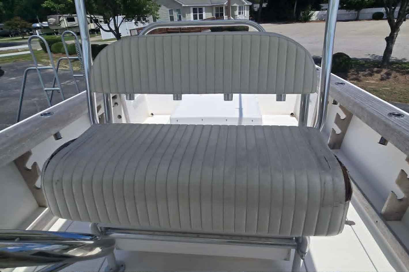 2003 True World Marine 286 boat seat with striped upholstery and metal frame.