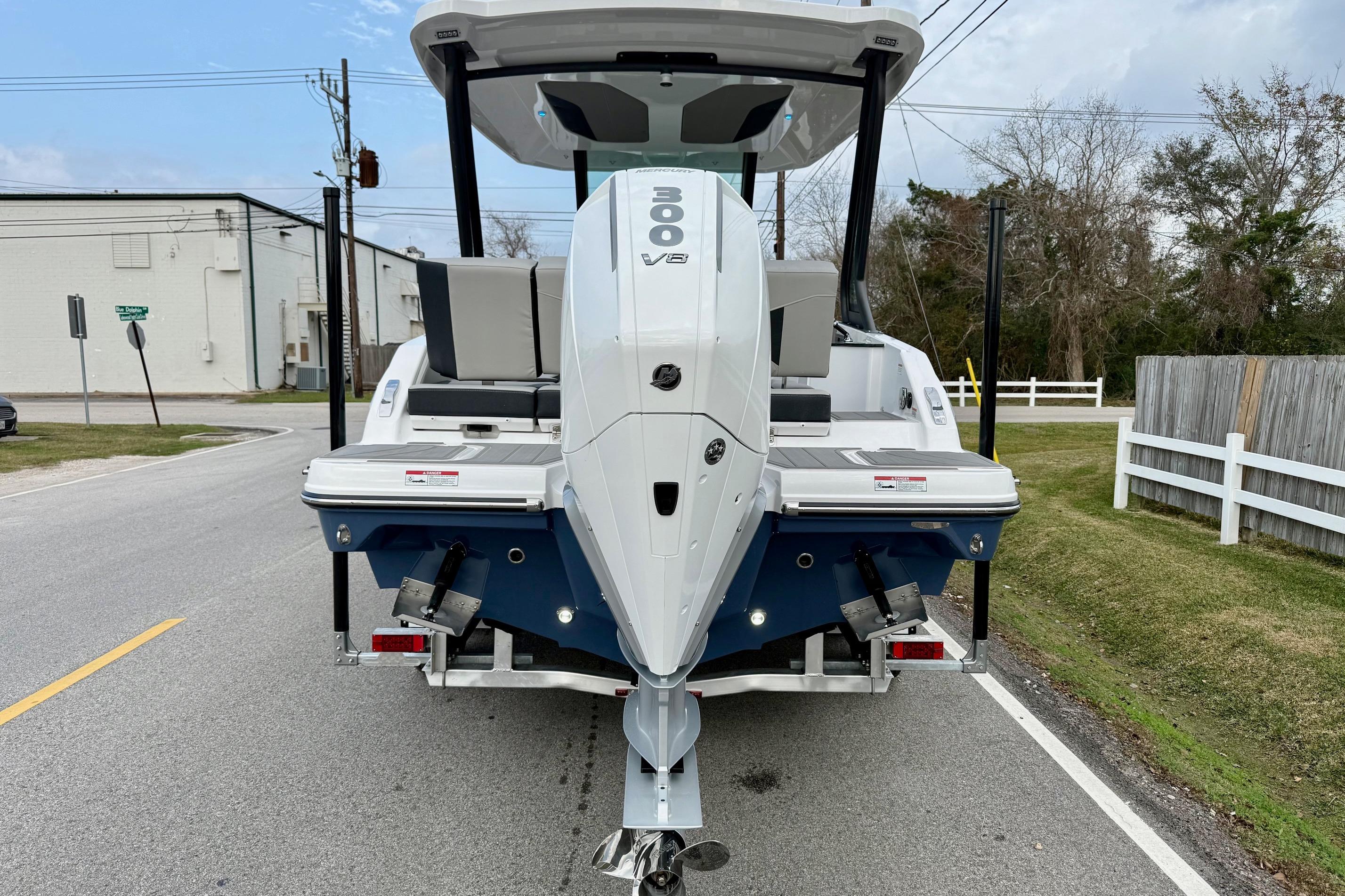 2026 Monterey Elite 25 OB boat with powerful 300 V8 engine on a trailer.