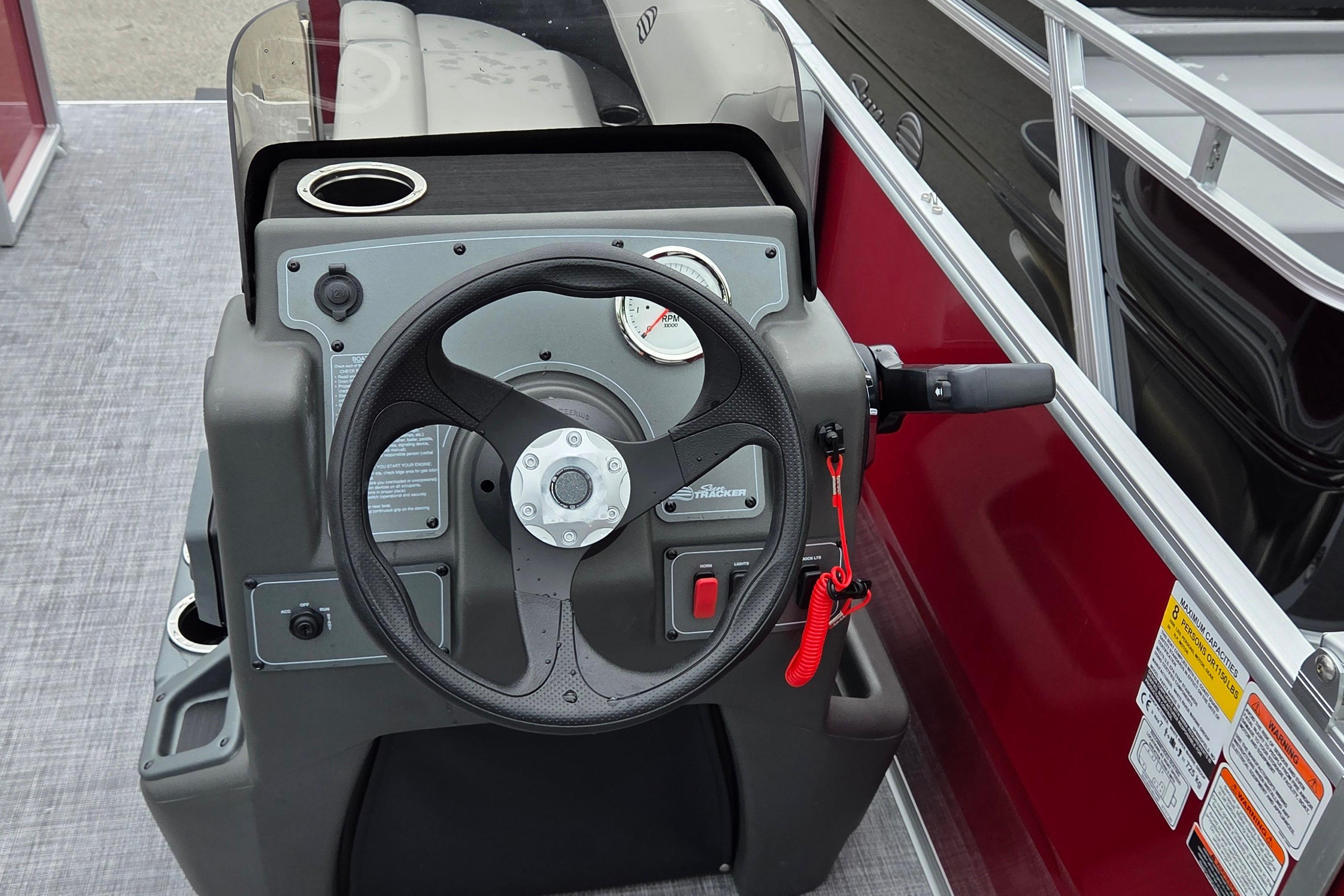 Steering console of 2026 Sun Tracker Party Barge 16 DLX pontoon boat.