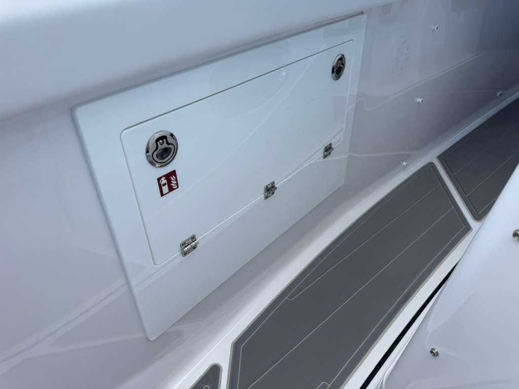 A storage compartment on a Monterey Elite 30 OB boat.