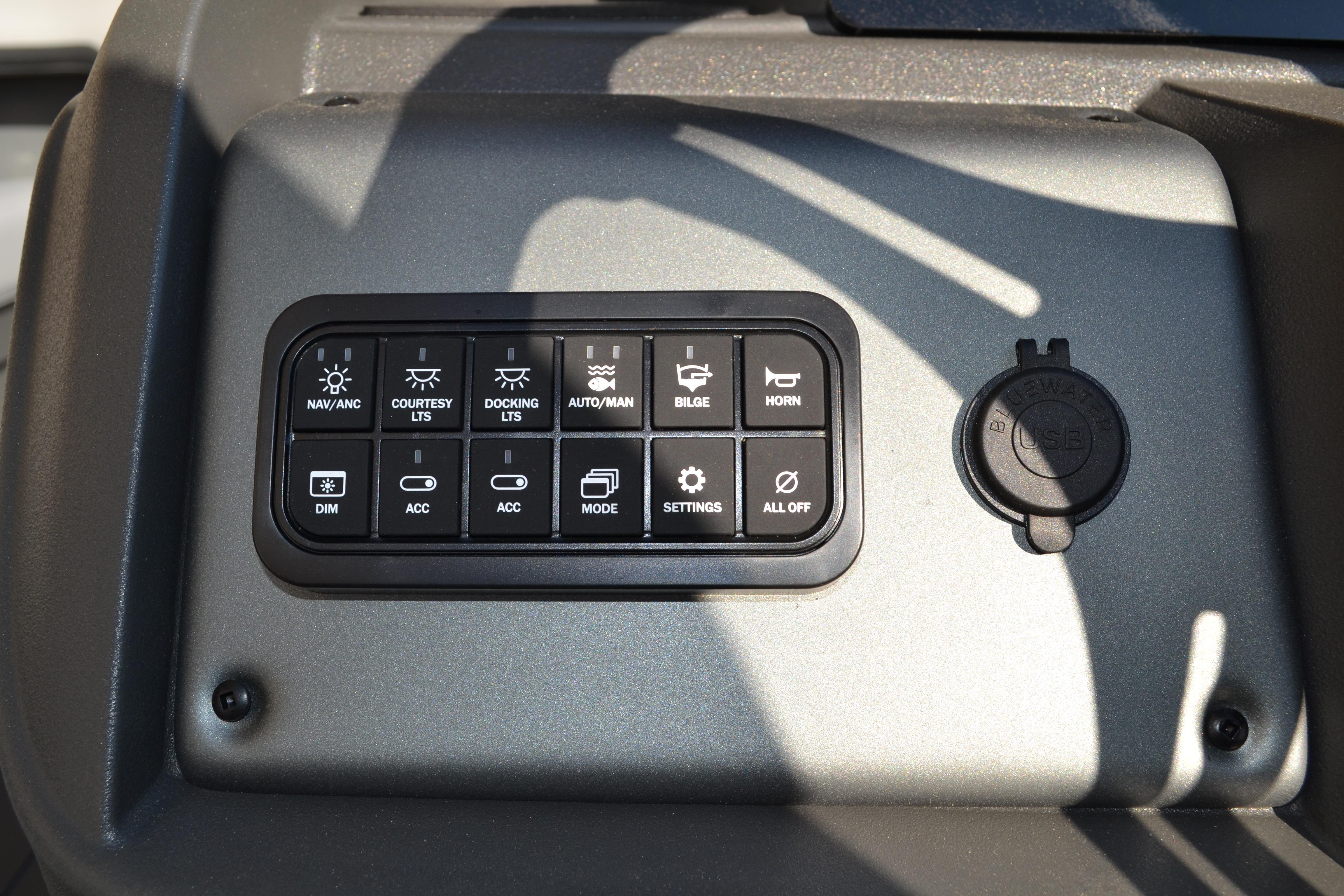 Control panel of 2026 Sun Tracker SportFish 22 XP3 with various function buttons.