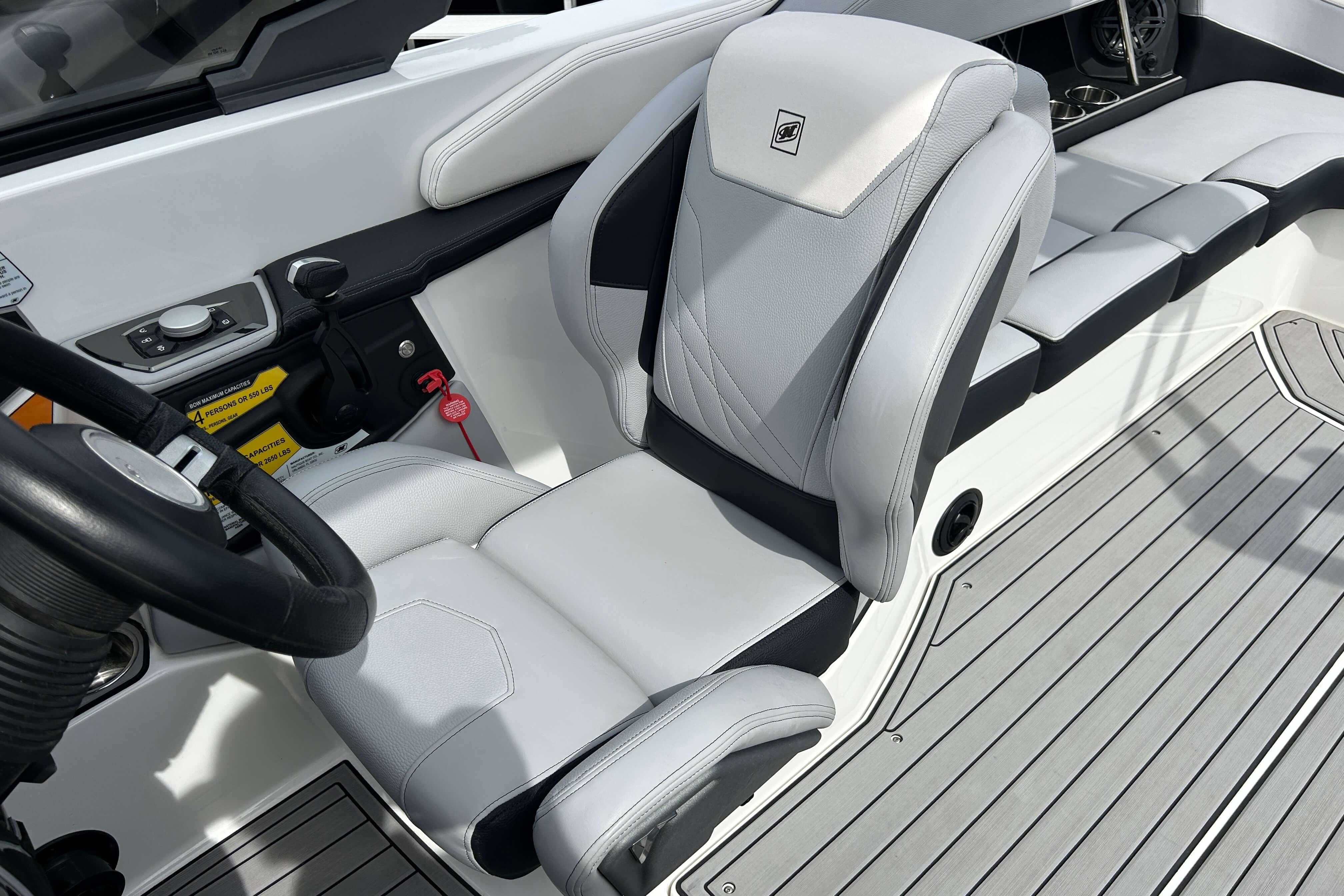 2021 Nautique Super Air Nautique GS24 interior with sleek, modern seating and controls.