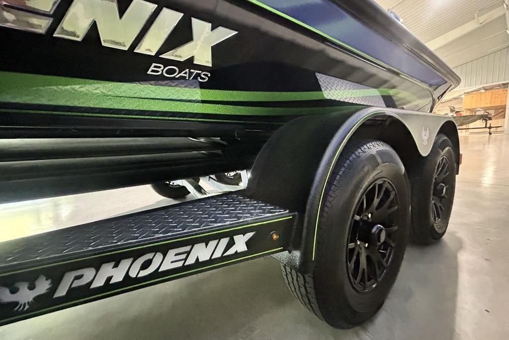 2026 Phoenix 819 ZXL boat trailer with black wheels and green accents.