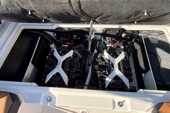 Engine compartment of 2026 Yamaha Boats 222SE, showcasing dual engines and advanced mechanics.
