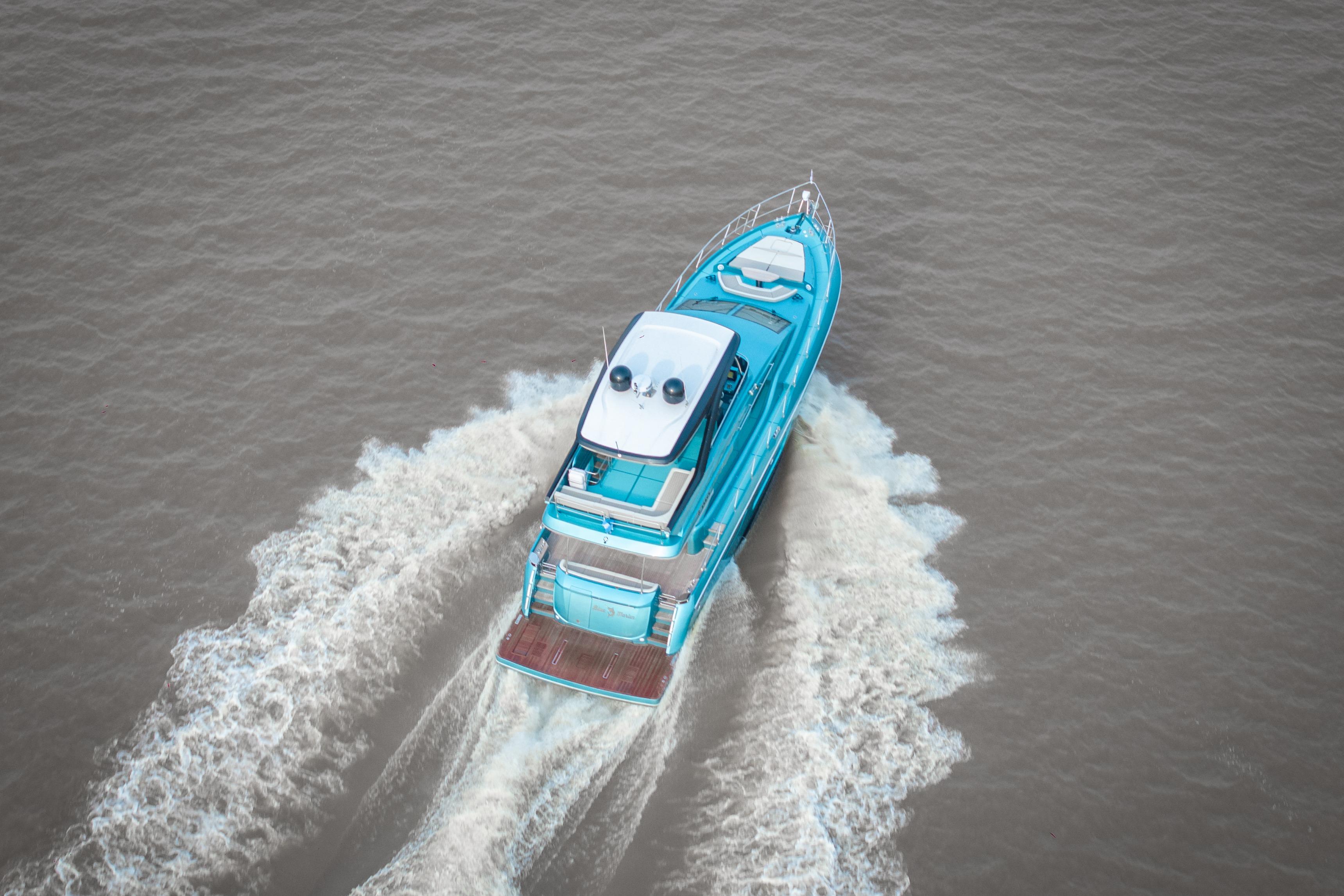 Aerial view of 2026 Segue X6 Black Edition yacht cruising on water.