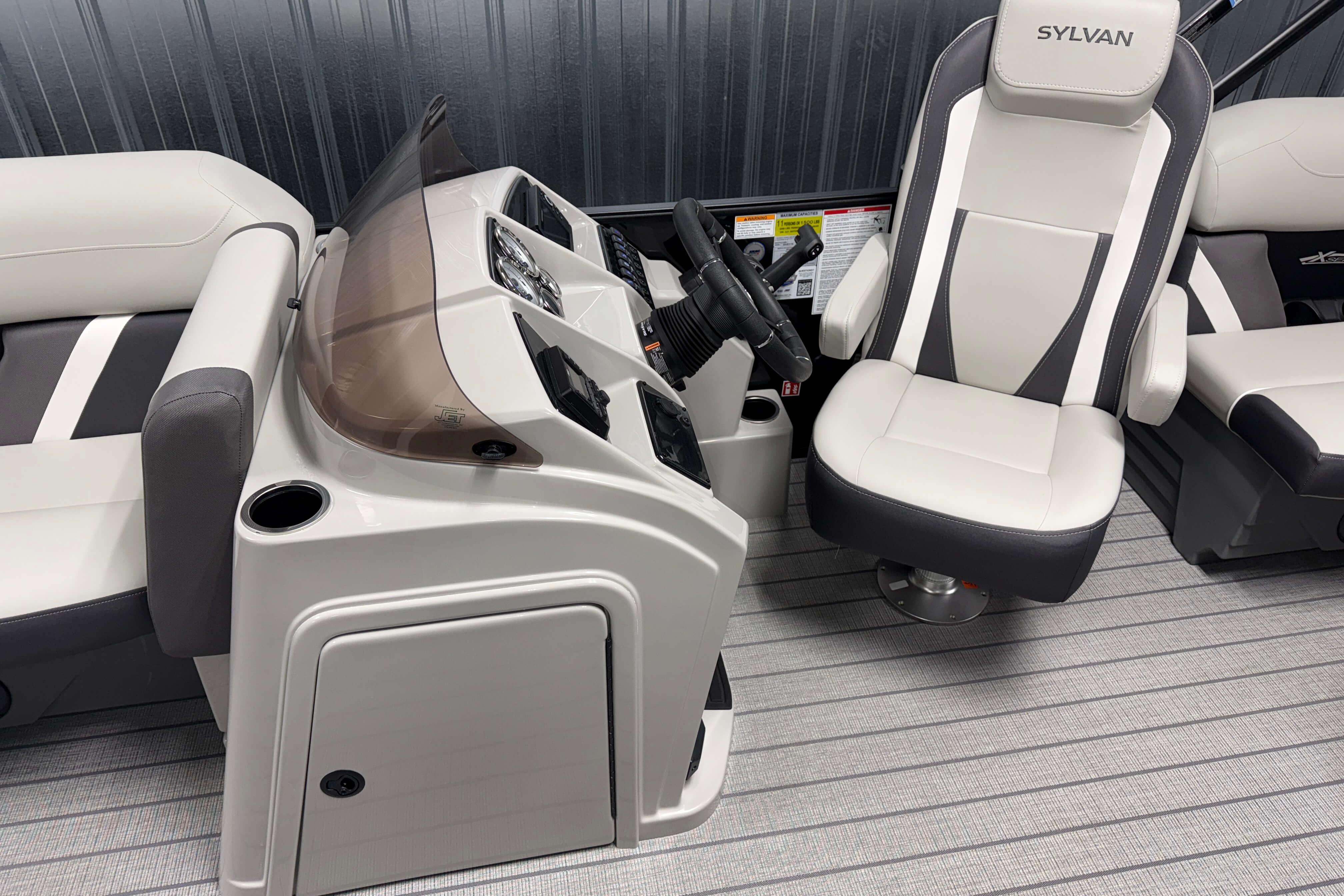 Interior of 2026 Sylvan Mirage X1 boat with modern helm and seating.