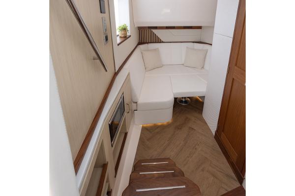 Manufacturer Provided Image: Luxurious interior of 2026 Regal LX43 yacht with modern seating and elegant wood finishes.