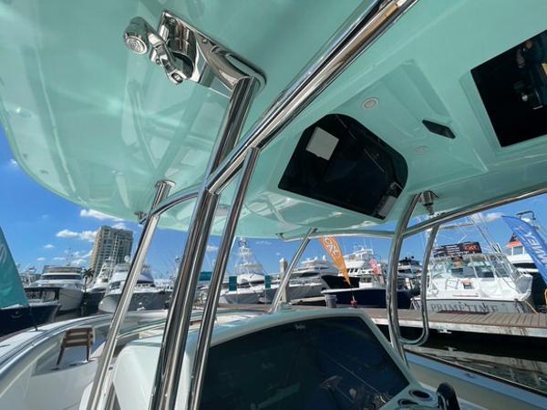 2025 Mag Bay 43 Center Console boat at a marina, showcasing its sleek design.