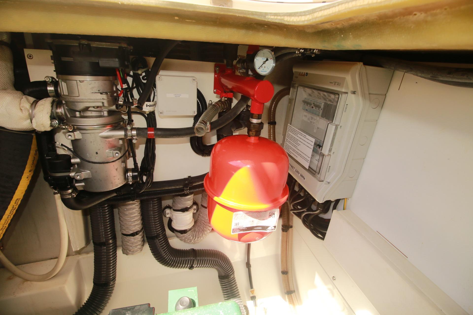 Engine compartment of 2022 Fountaine Pajot Elba 45 Catamaran, featuring mechanical components and wiring.