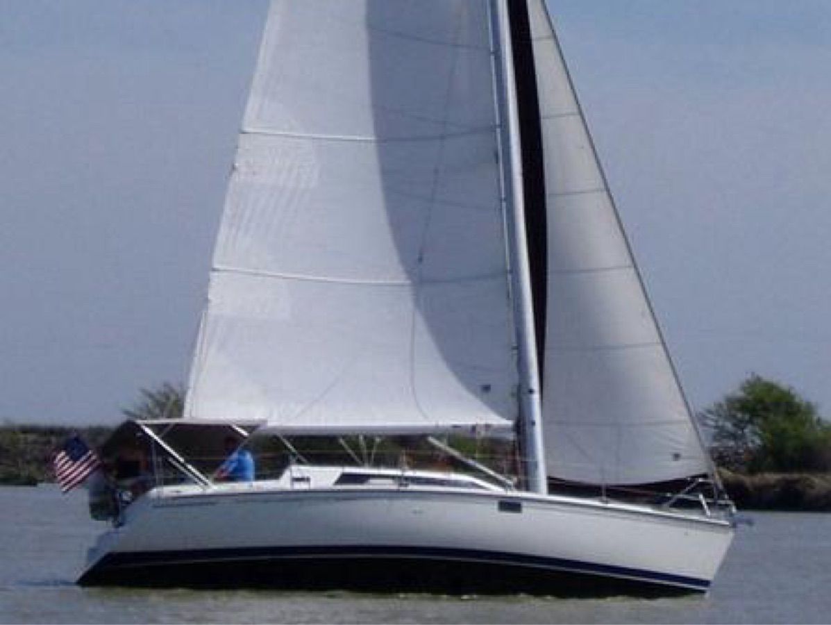 1995 Hunter 36 Vision sailboat on the water.