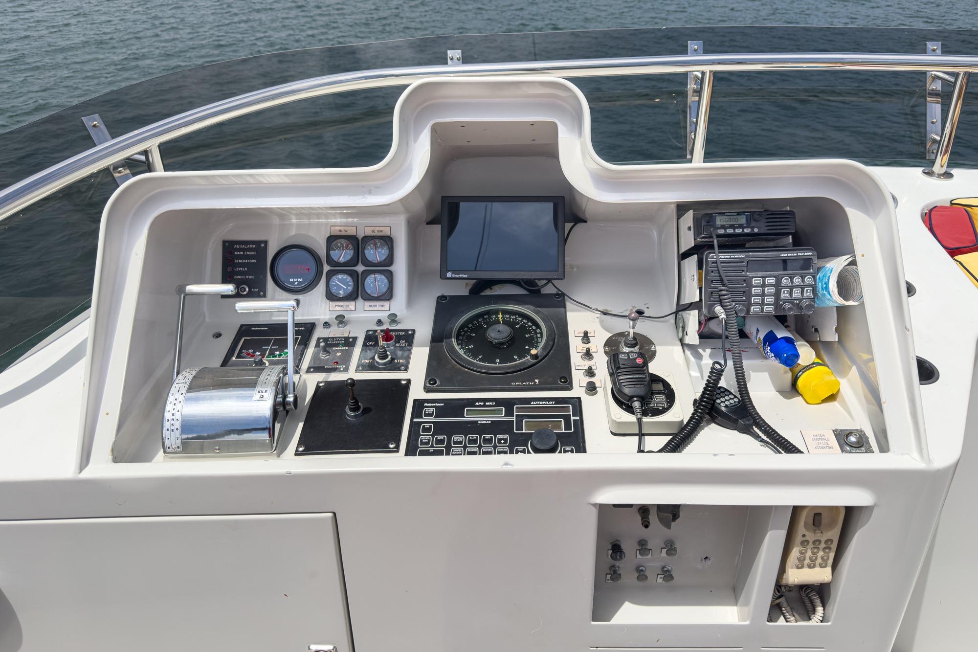 Control panel of a 1990 Seaton Long Range Cruiser with navigation and communication equipment.