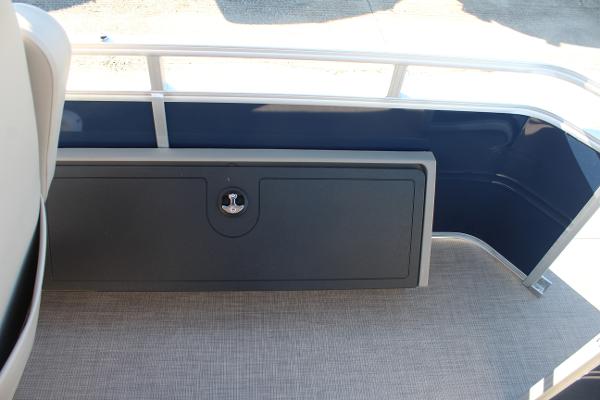 Sun Tracker Fishin' Barge 22 DLX 2025, interior storage compartment, blue and gray design.
