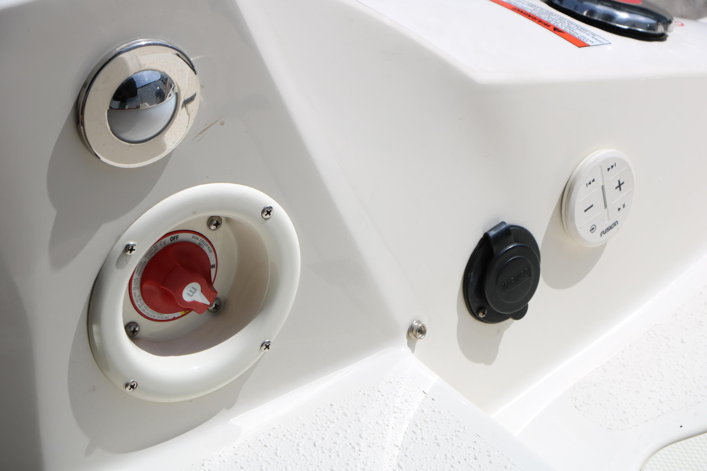 2022 Stingray 192 SC boat control panel with switches and dials.