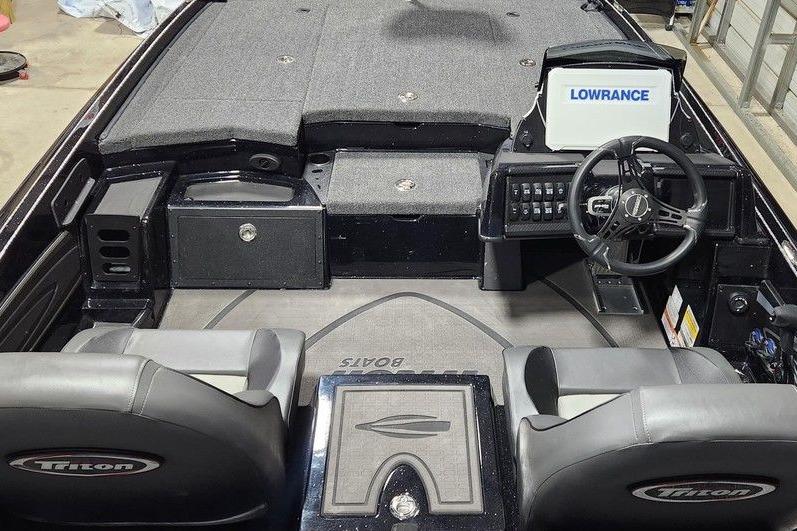 Interior of 2026 Triton 20XP Patriot boat with Lowrance navigation system.