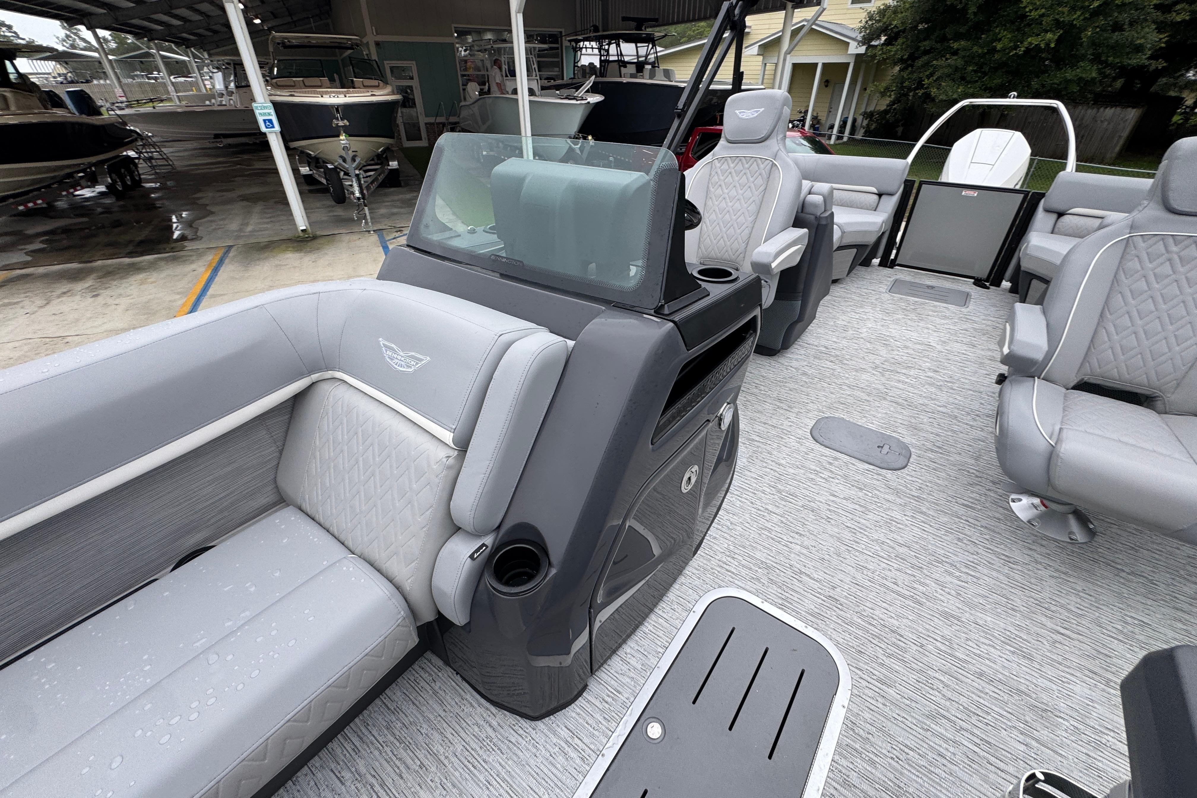 2027 Bennington 24 MFB pontoon boat interior with luxurious gray seating and modern design.