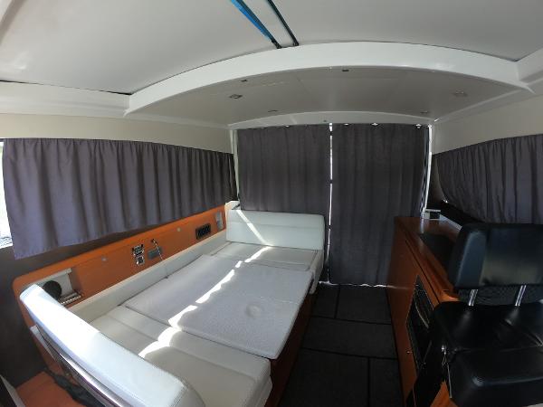 Interior of 2017 Jeanneau NC 11 boat with seating and curtains.