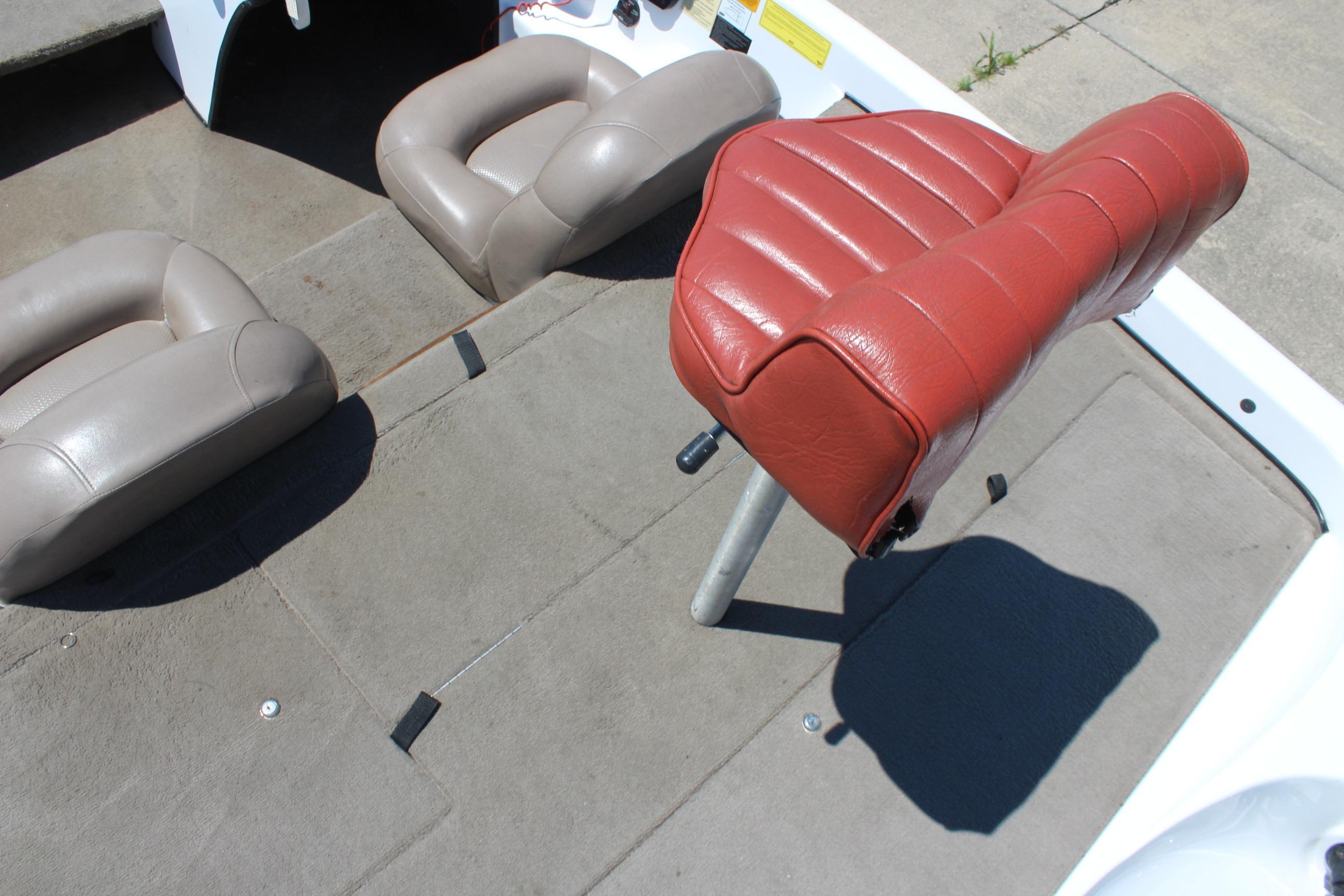 Interior of a 2003 Nitro NX 750 SC boat with red and beige seating.