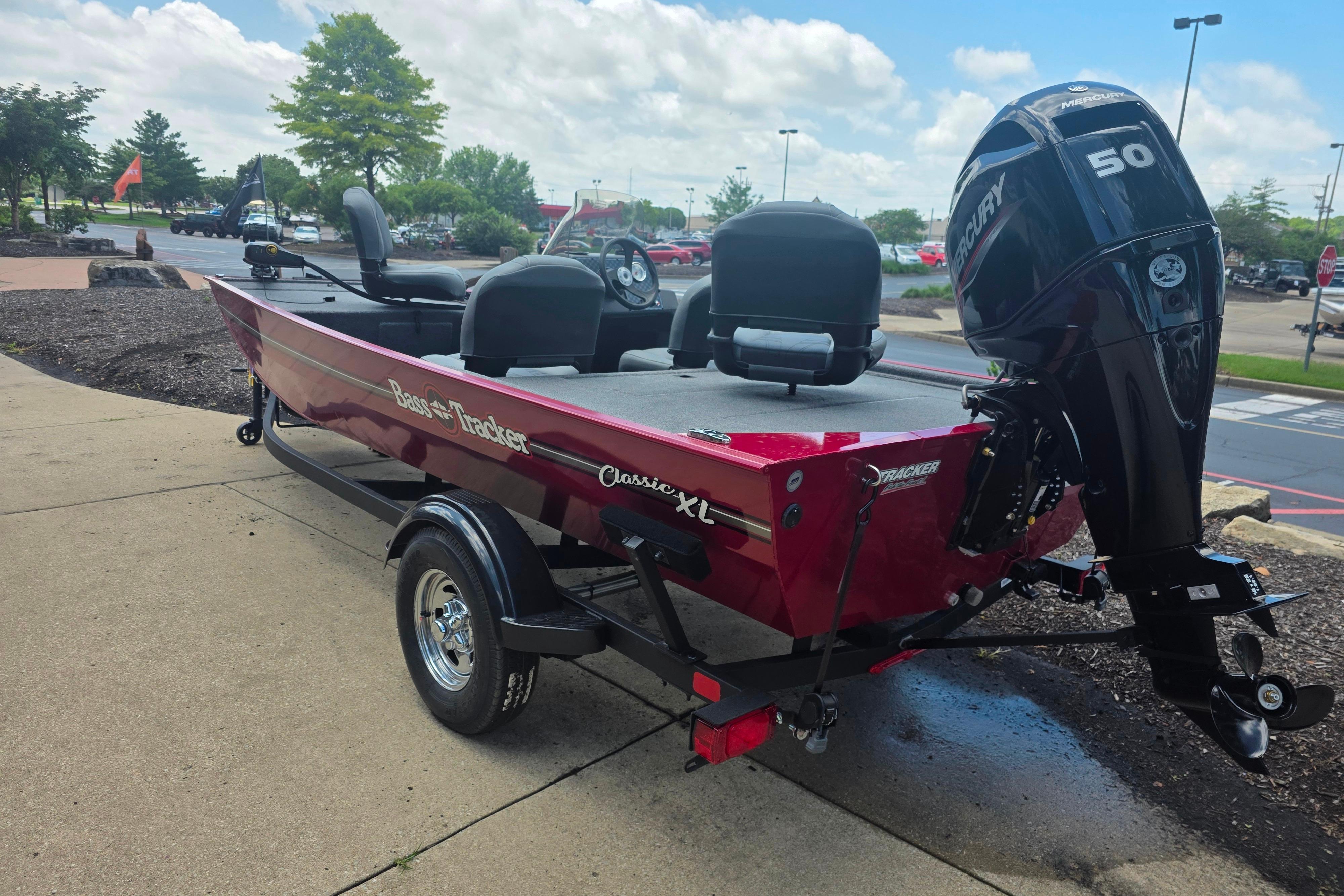 2026 Tracker Bass Tracker Classic XL boat with Mercury 50 engine, parked outdoors.