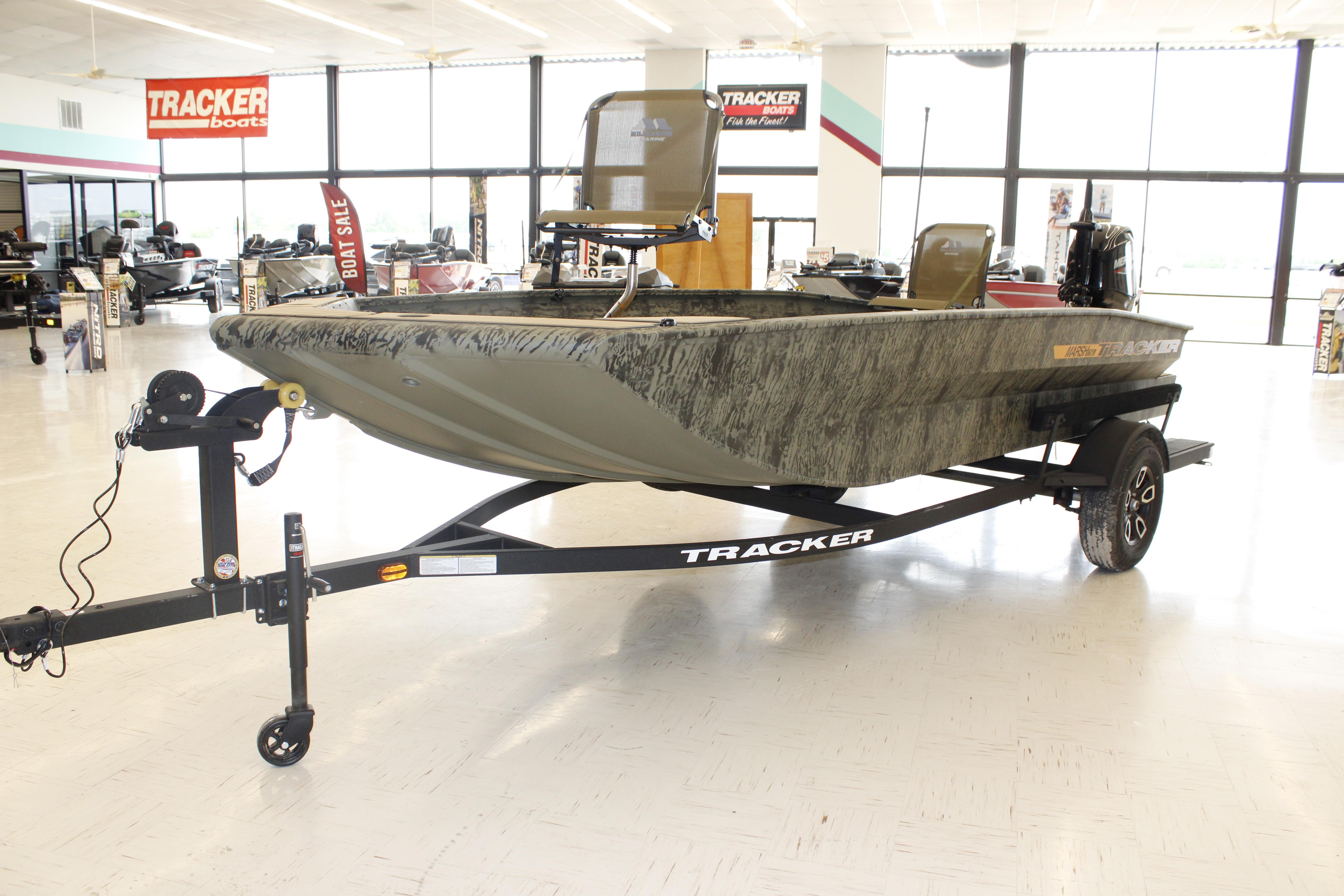 2026 Tracker Grizzly 1756 T Marsh boat displayed in showroom on trailer.