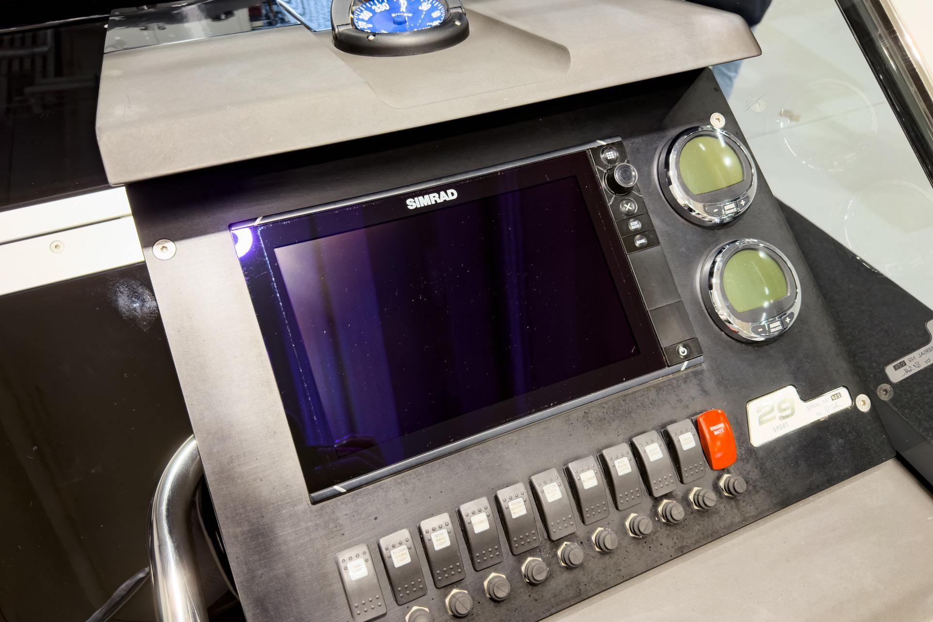 Control panel of 2016 Goldfish 29 Sport boat with Simrad display and gauges.