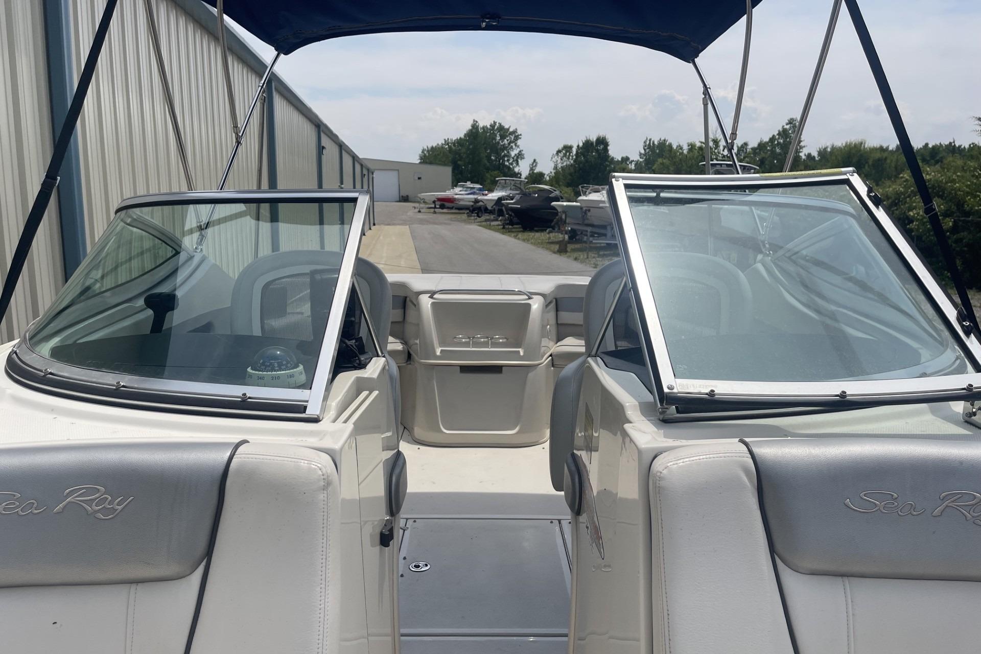 2010 Sea Ray 230 Bow Rider Select boat with open windshield and canopy.