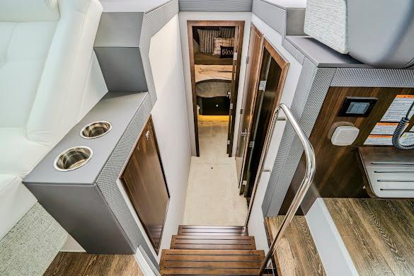 Interior view of 2023 Cruisers Yachts 42 Cantius, featuring modern stairs and sleek design.