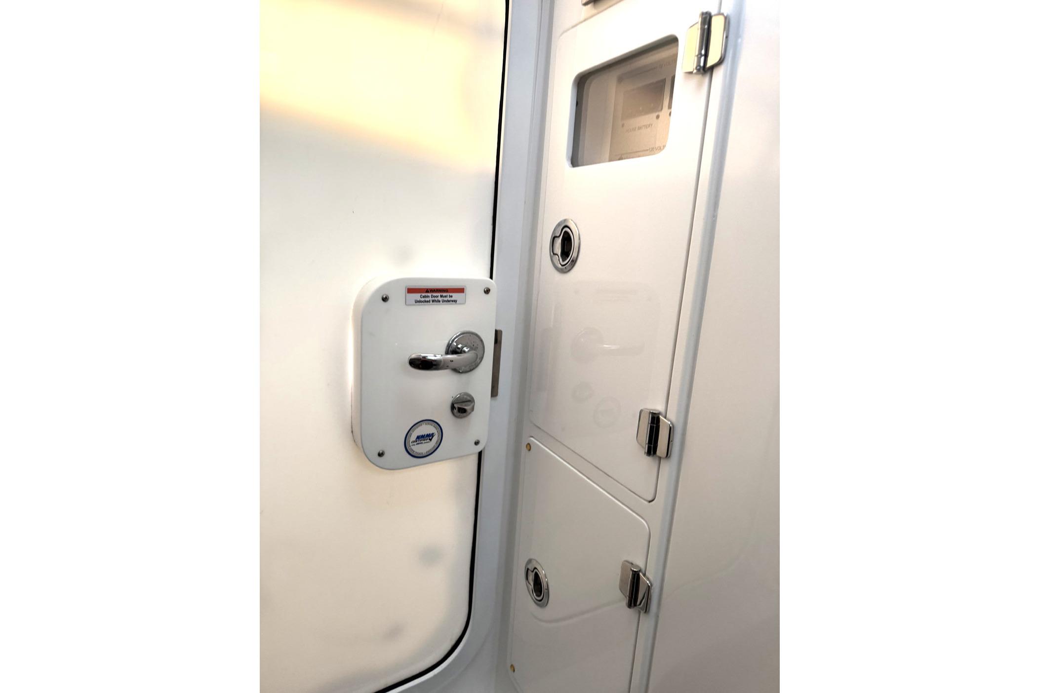 2019 HCB 39 Speciale cabin door with chrome handle and secure locking mechanism.