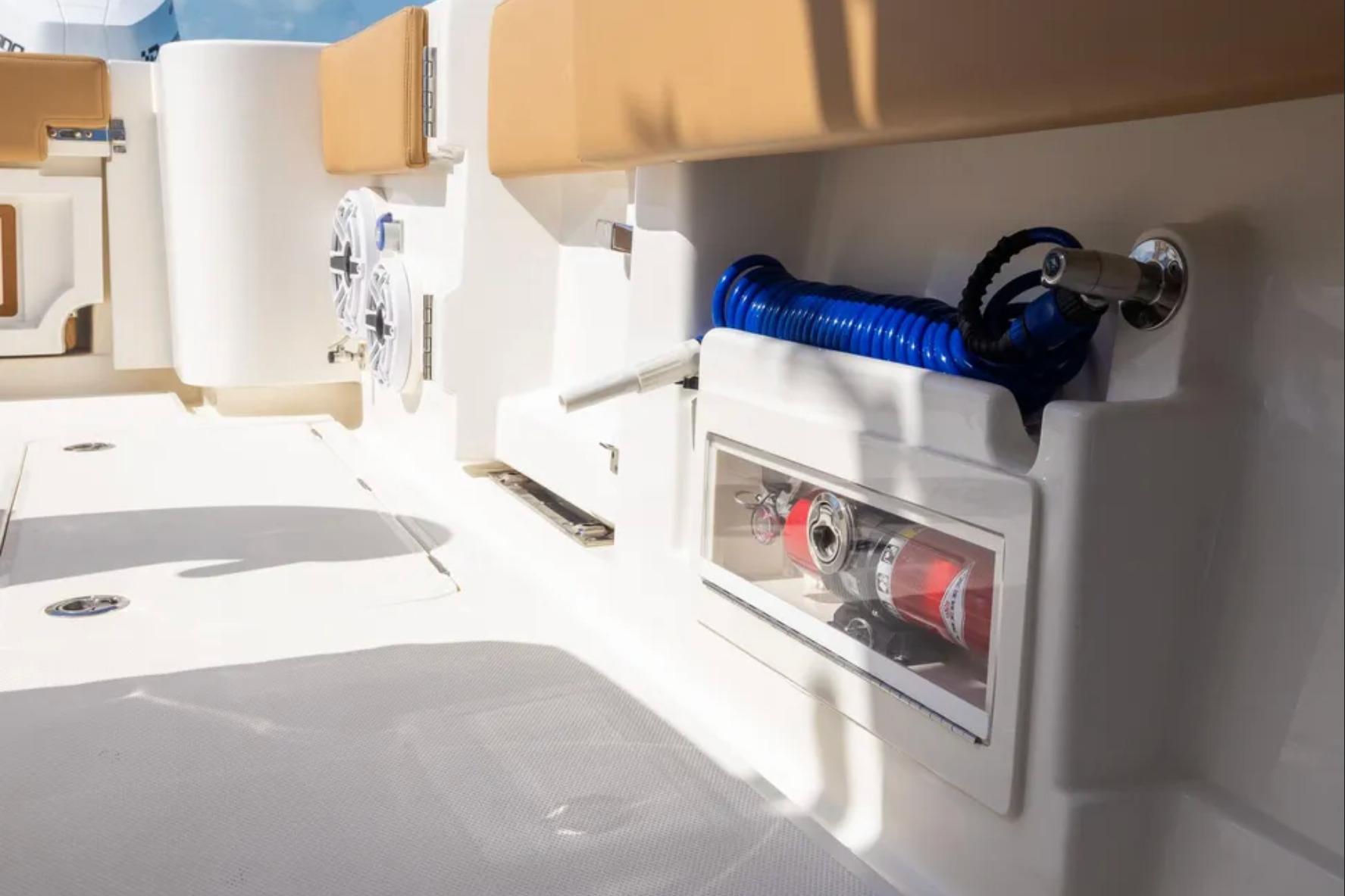 2025 Blackwater 41 Performance Fish boat interior with storage and coiled hose.