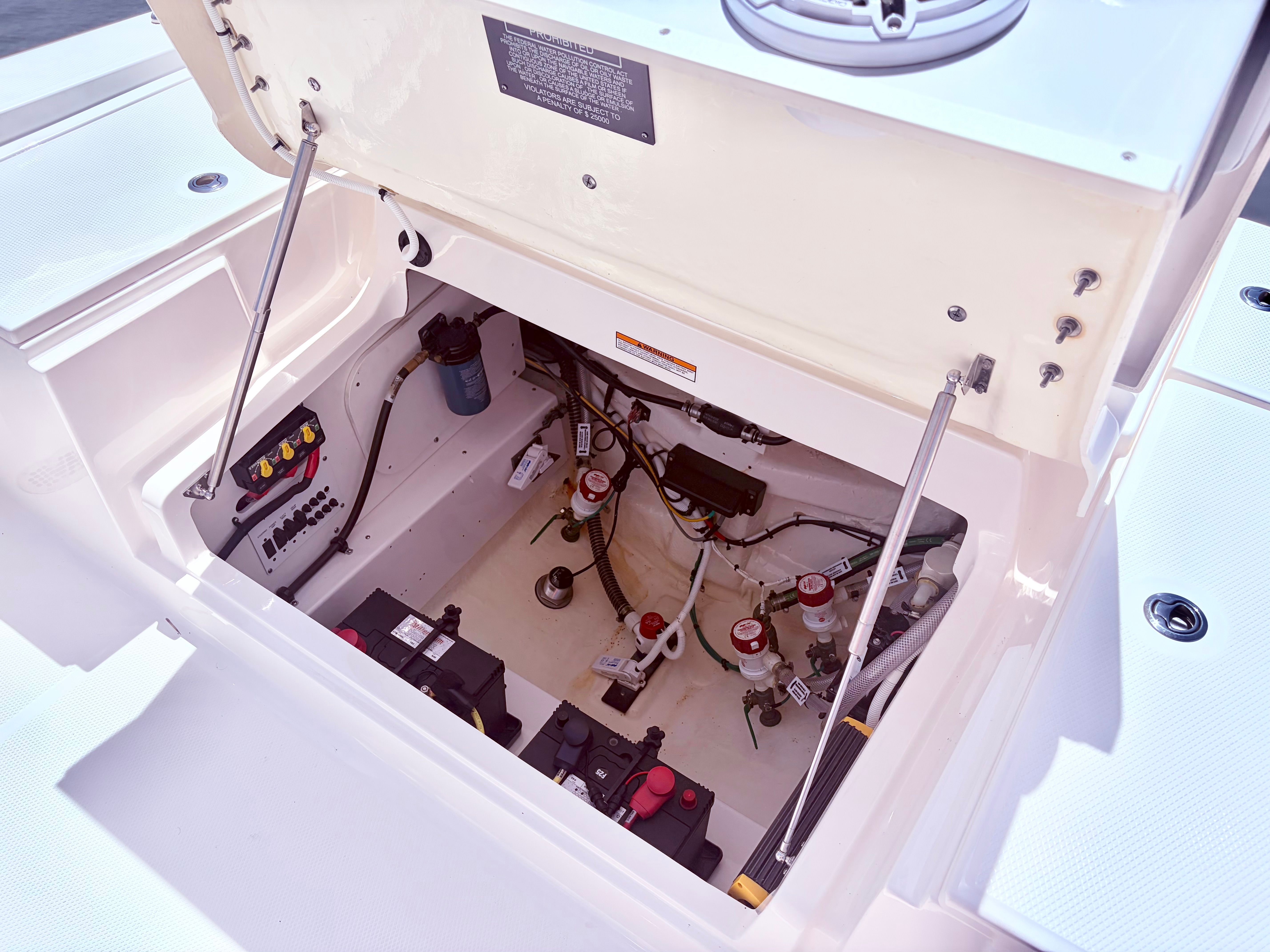 Robalo 266 Cayman 2025 boat engine compartment with equipment.