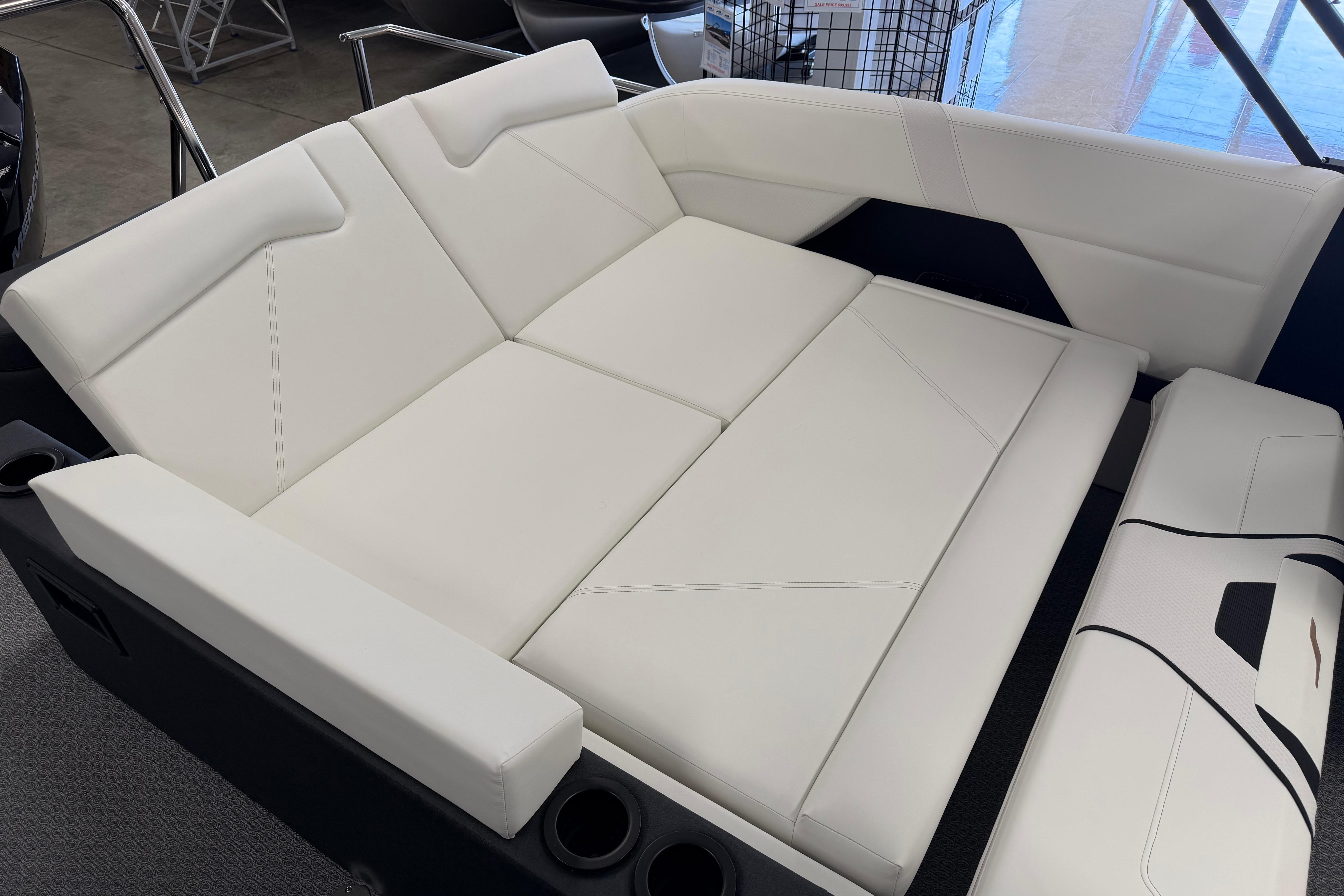 Luxurious white seating on 2026 Evotti 721CS boat, featuring modern design and comfort.