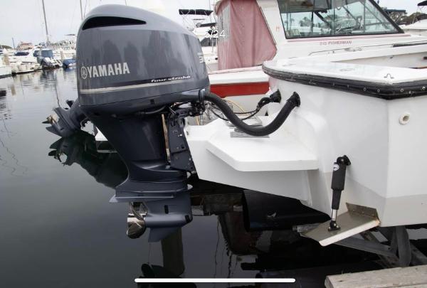 1979 Chaparral 224 Fisherman with Yamaha outboard motor at marina.