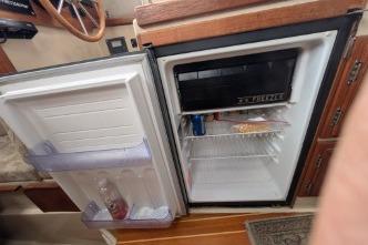 Open mini fridge.