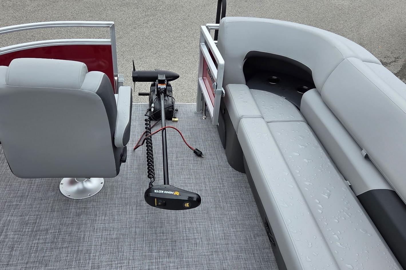 2026 Sun Tracker SportFish 20 DLX interior with seating and trolling motor.