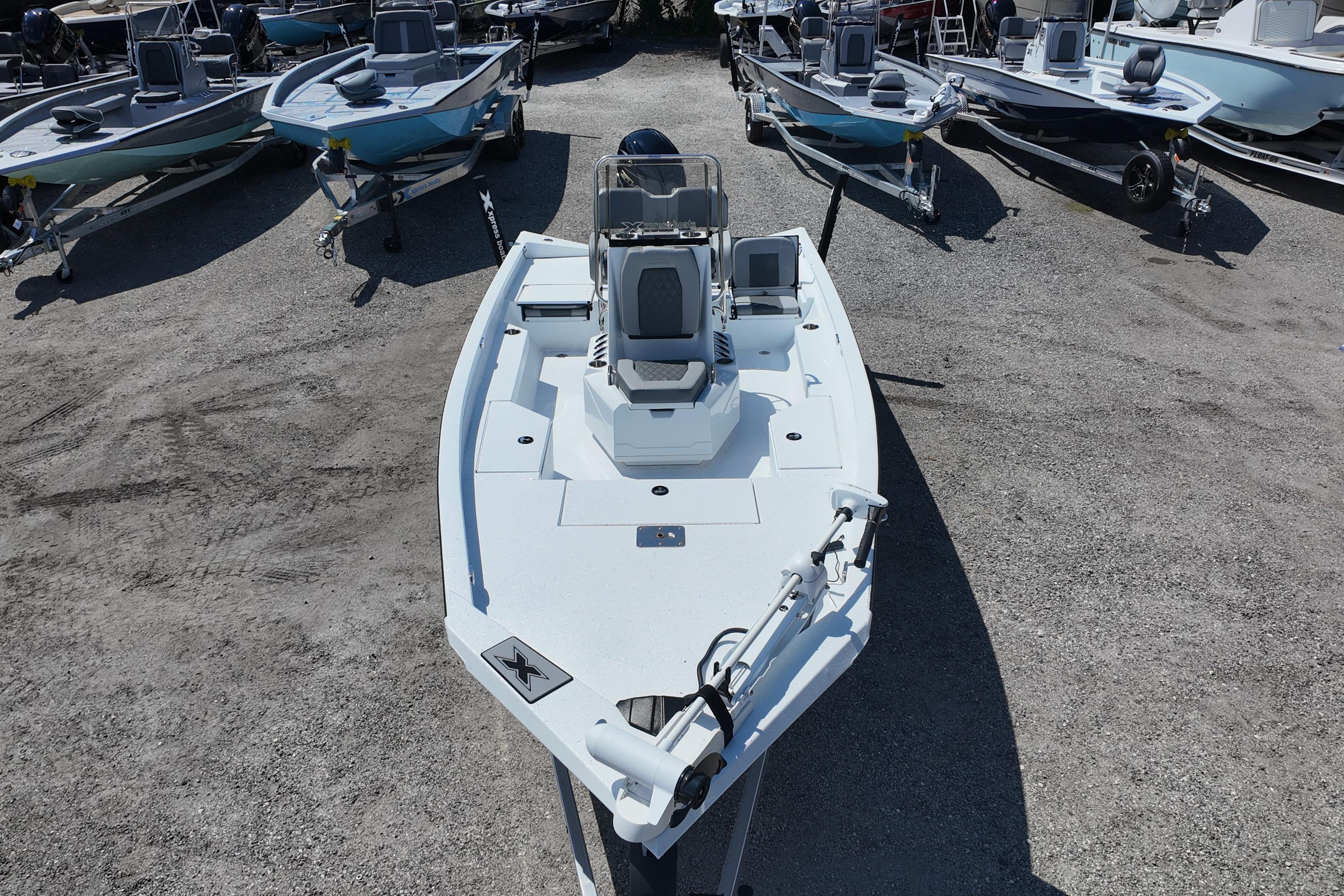 2026 Xpress H20 boat displayed in a lot with other boats.
