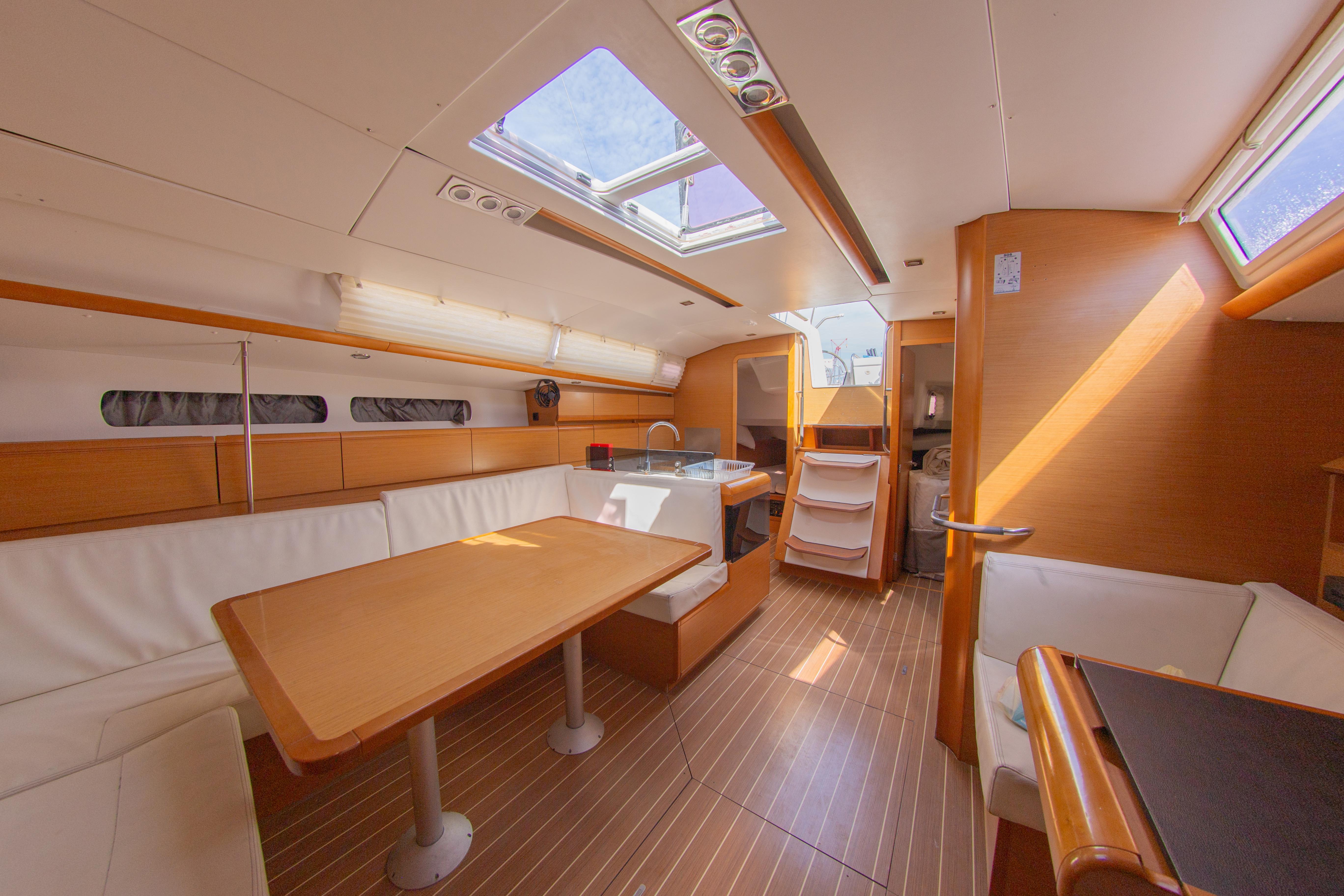 Interior of 2012 Jeanneau Sun Odyssey 439 sailboat, featuring spacious seating and modern design.