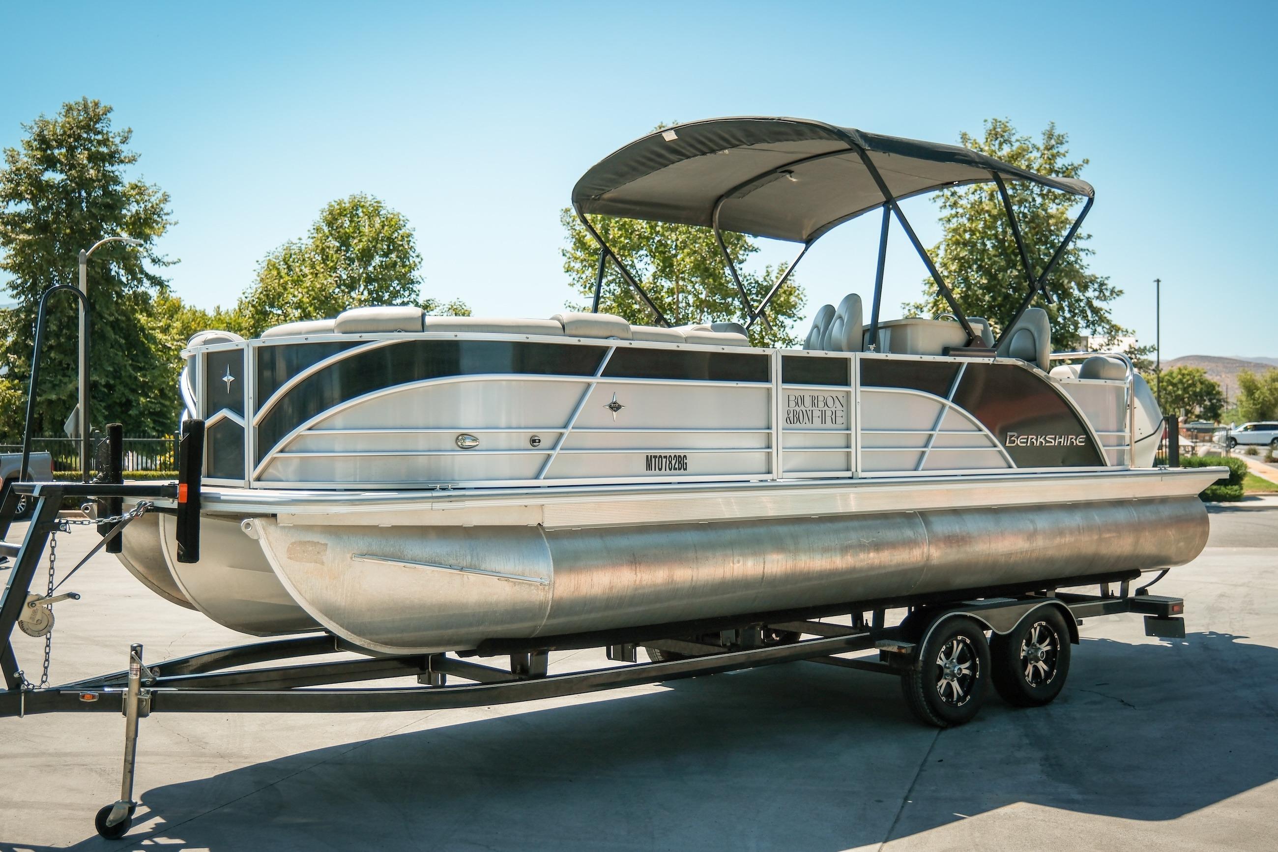 2019 Berkshire 25CLE STS pontoon boat on trailer, parked outdoors.