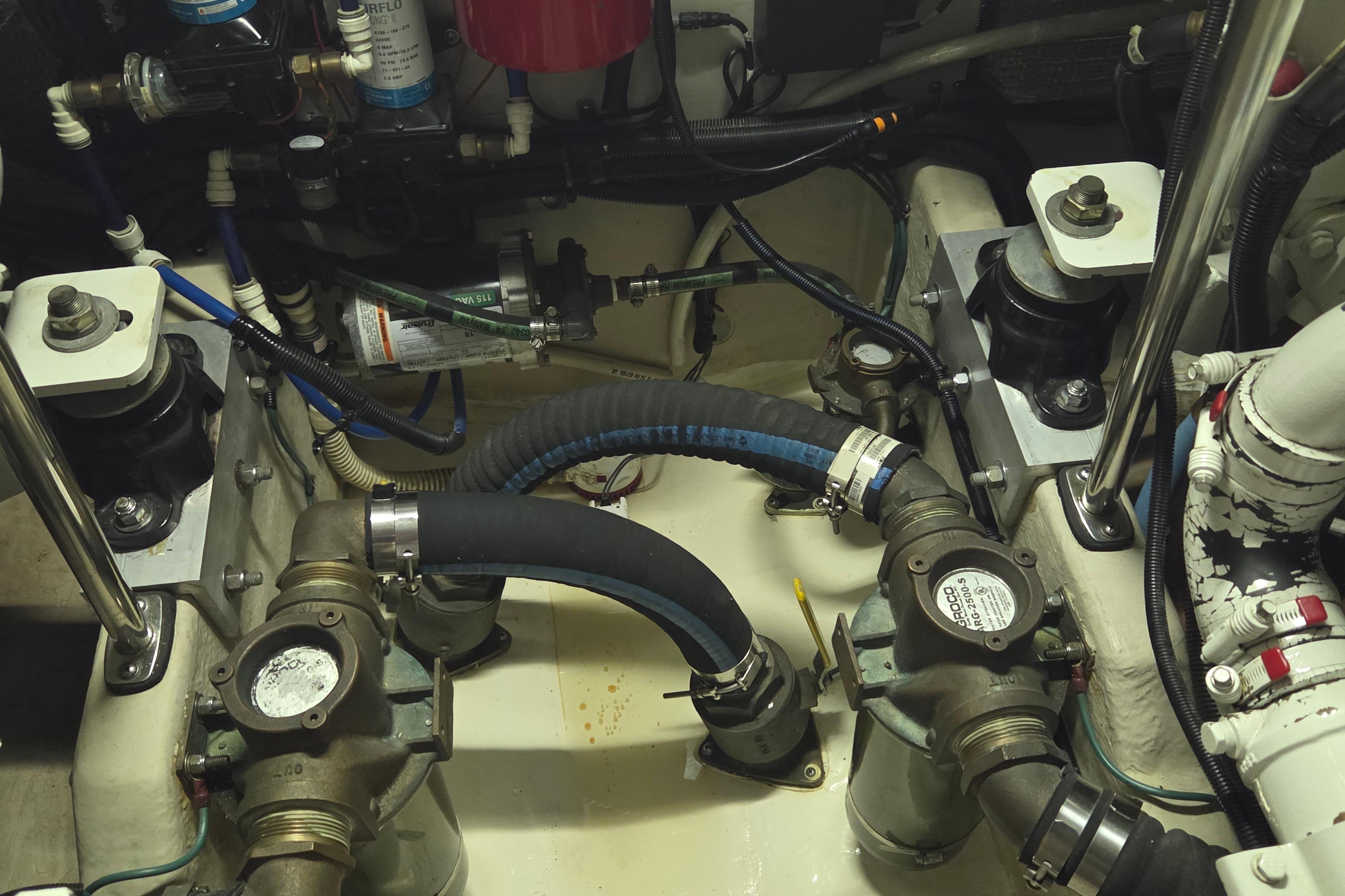 Engine room of a 2000 Sea Ray Sundancer 540 with visible mechanical components.
