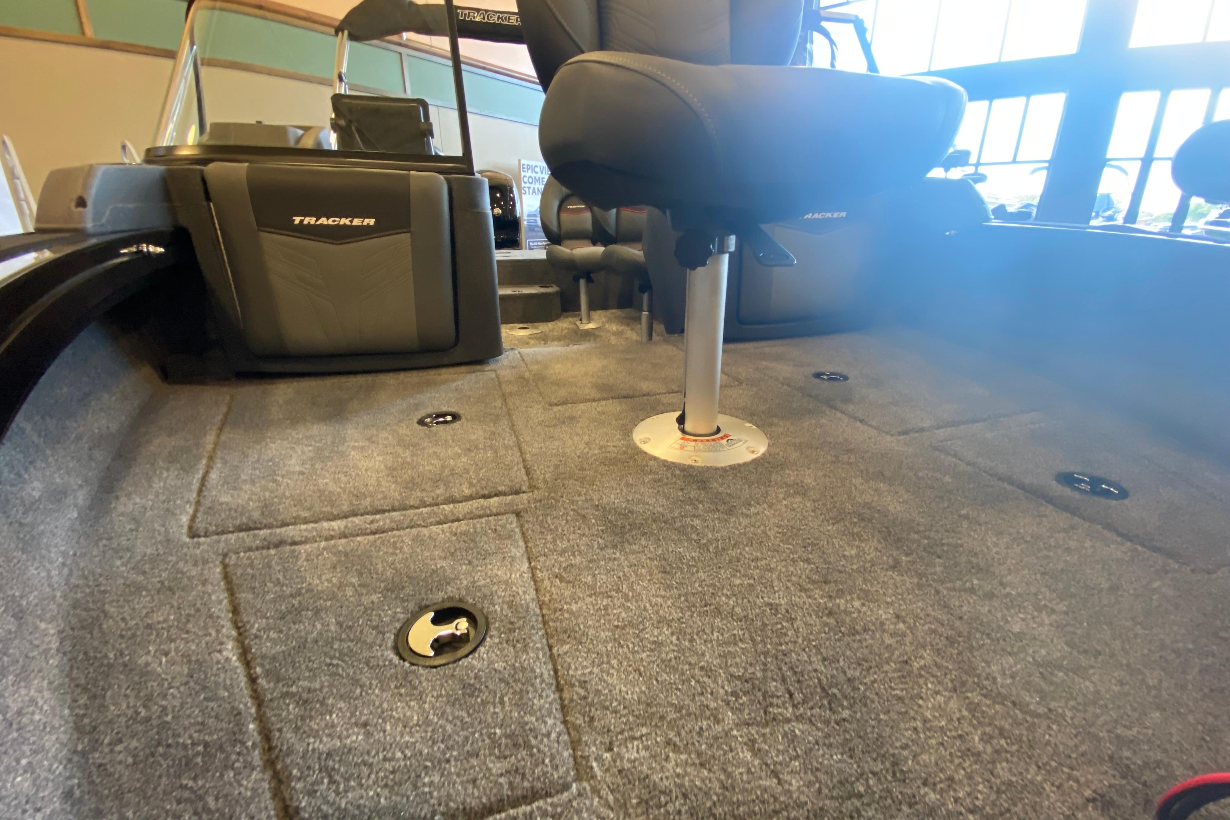 2026 Tracker Targa V-19 WT boat interior with carpeted flooring and seating.