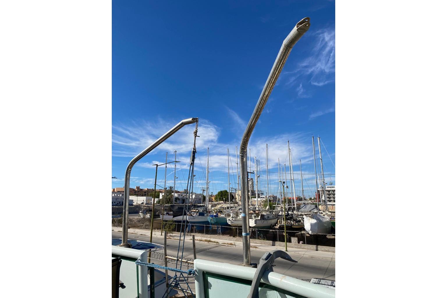1979 Shrimper Conversion Trawler with marina backdrop under clear blue sky.