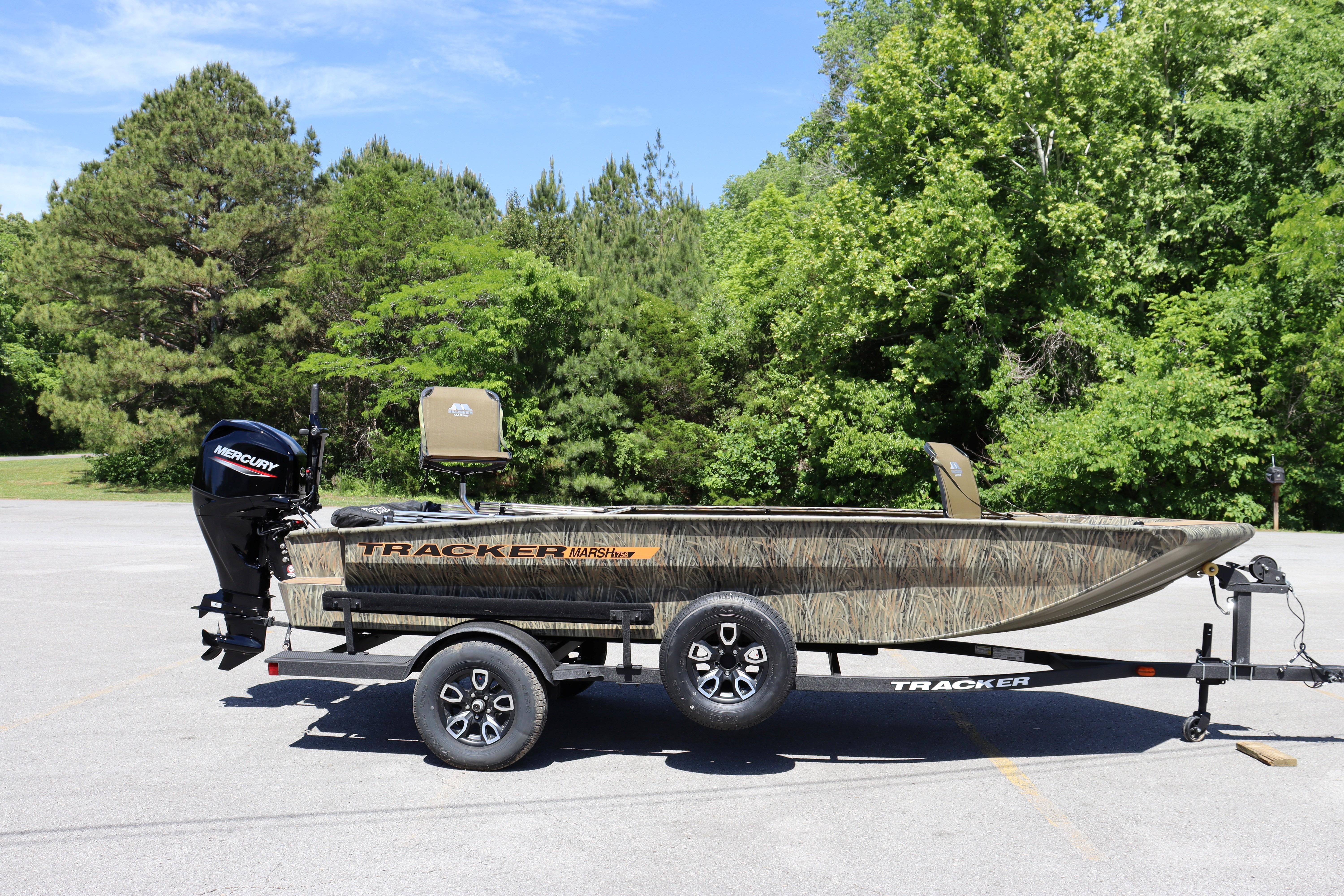 2026 Tracker Grizzly 1756 T Marsh boat on trailer, parked outdoors.