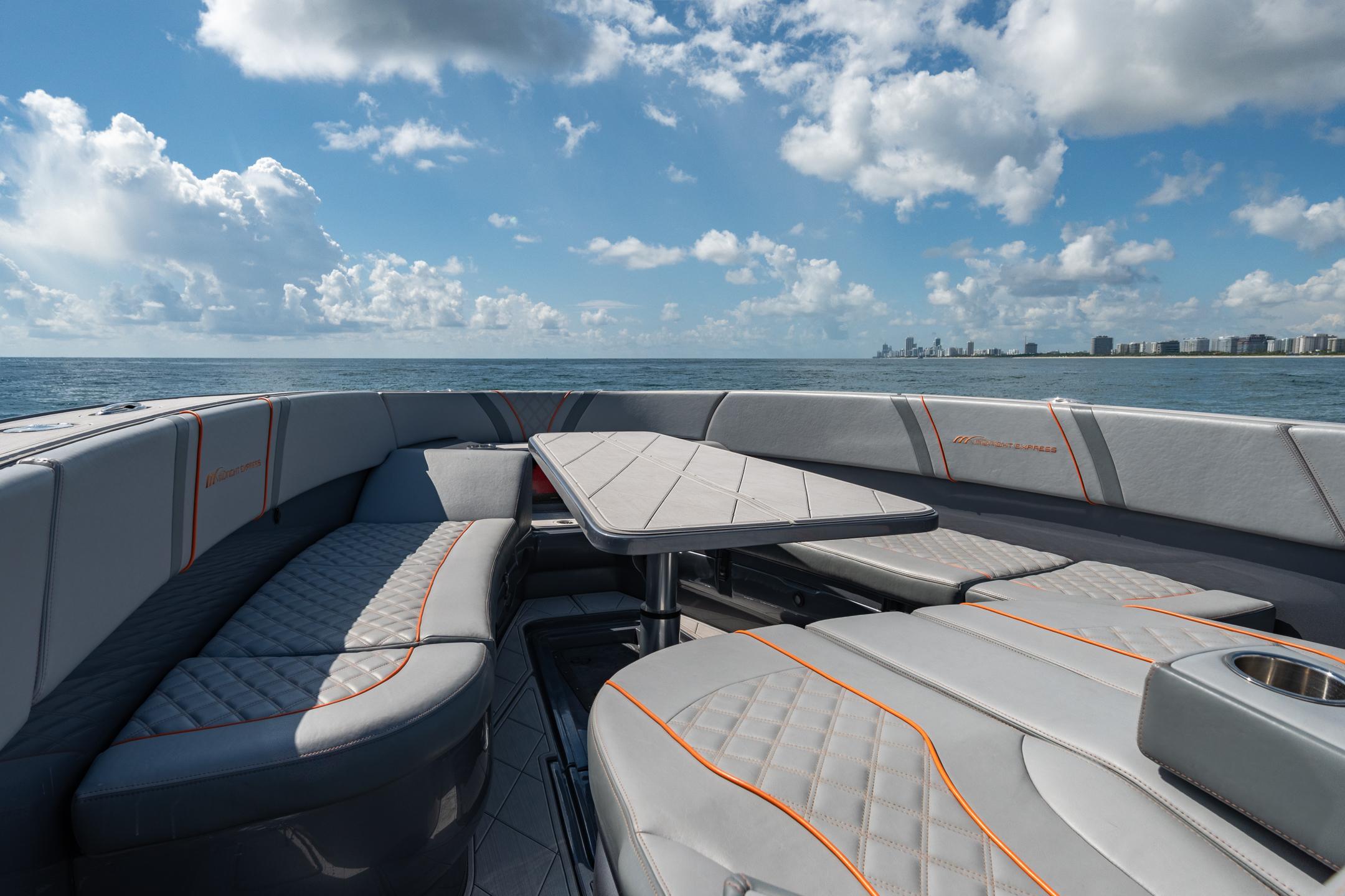 Luxurious seating on 2022 Midnight Express 37' Open boat, ocean view.