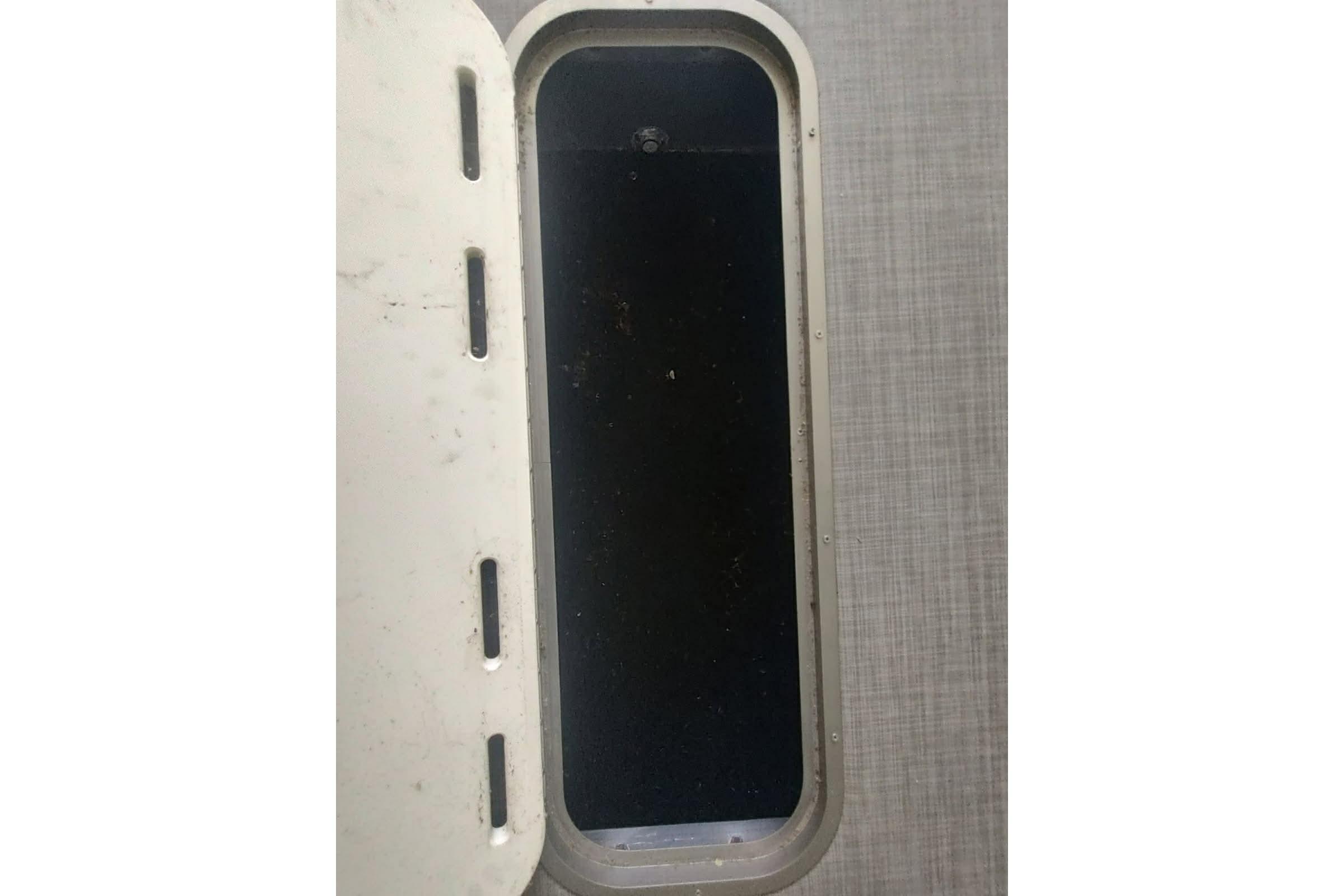 Open storage compartment on 2023 PlayCraft 27 Infinity boat.