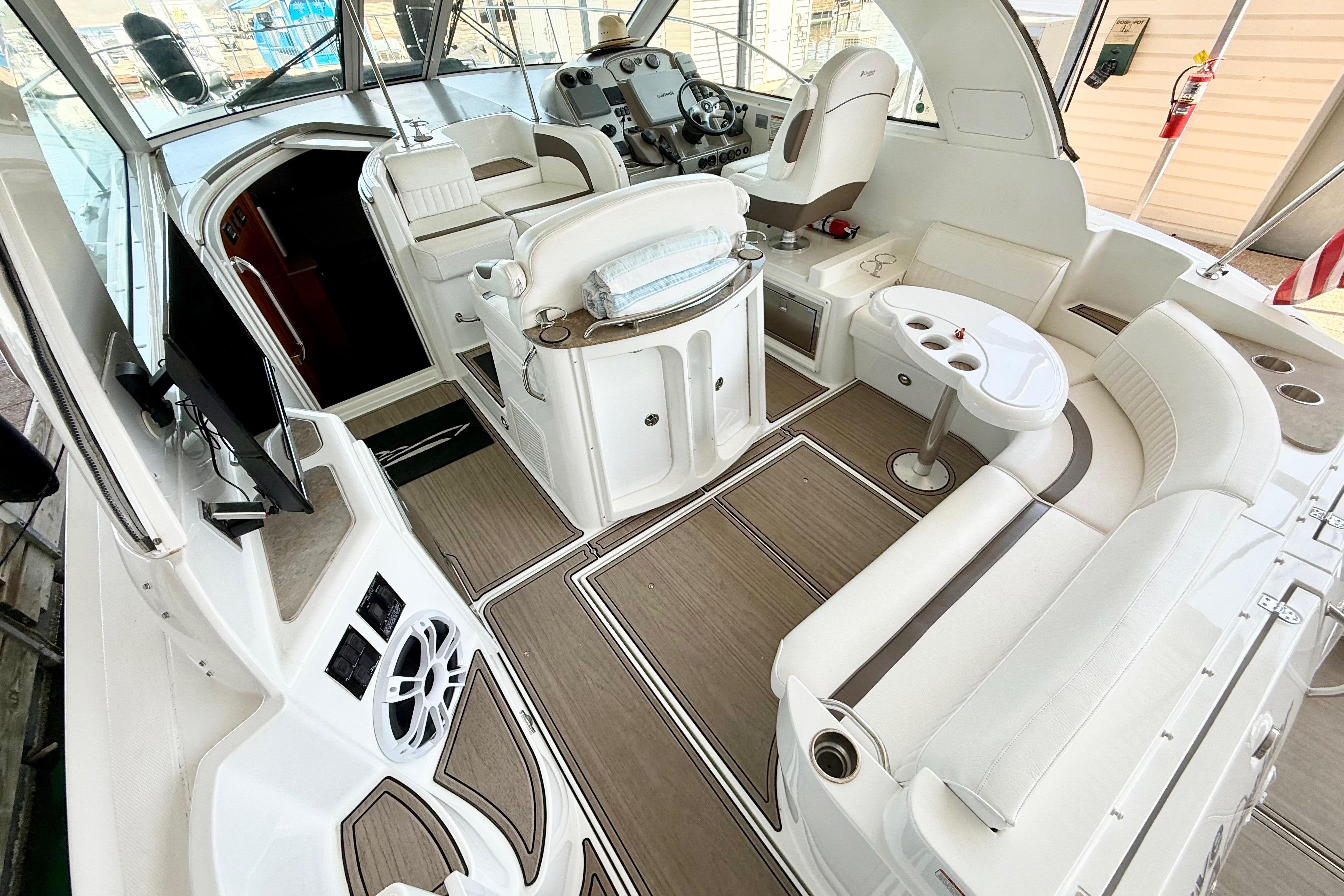 Luxurious interior of 2011 Cruisers Yachts 390 Sports Coupe with elegant seating and helm.