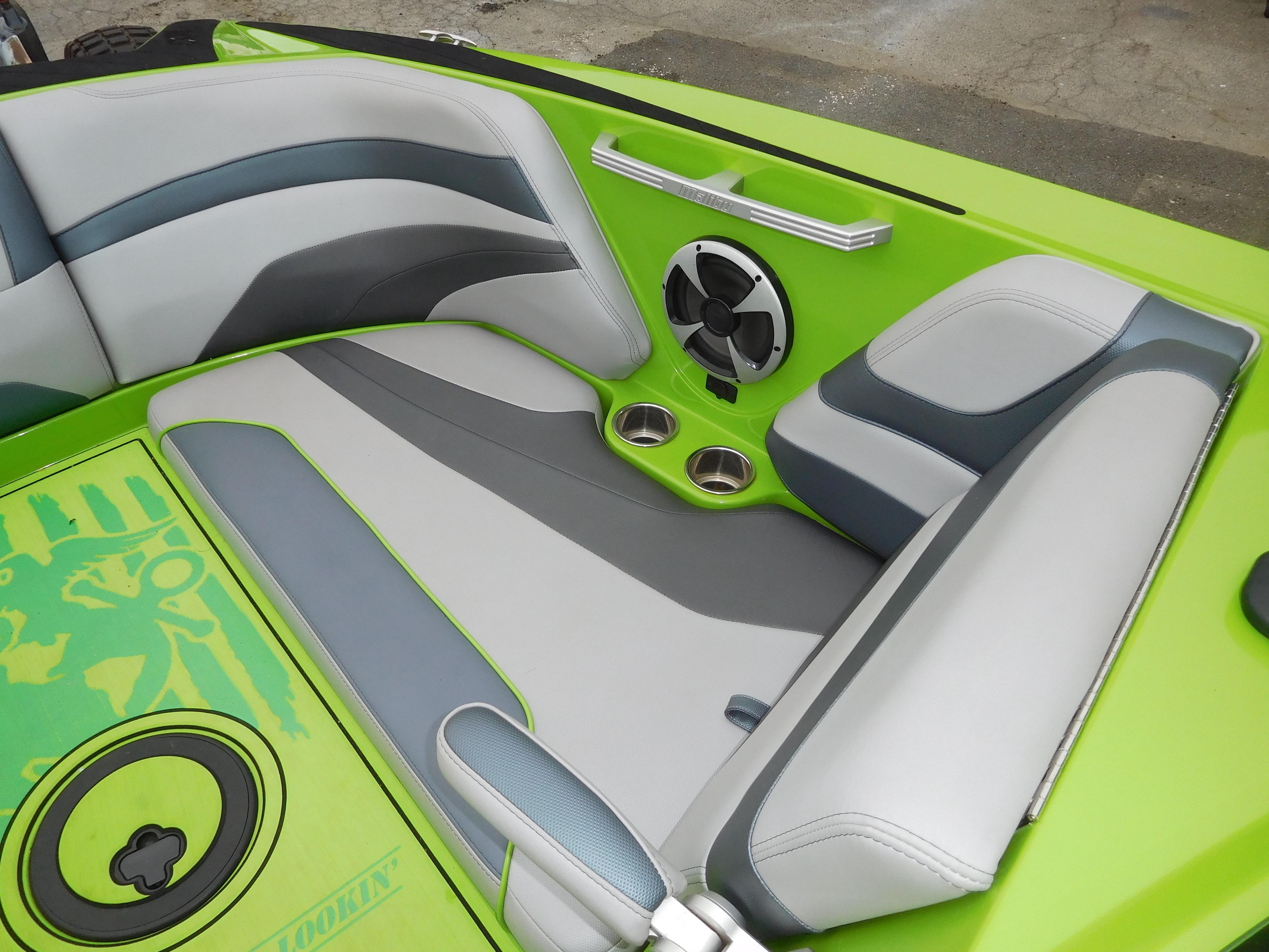 2017 Malibu Wakesetter 24 MXZ interior with green and gray seating.