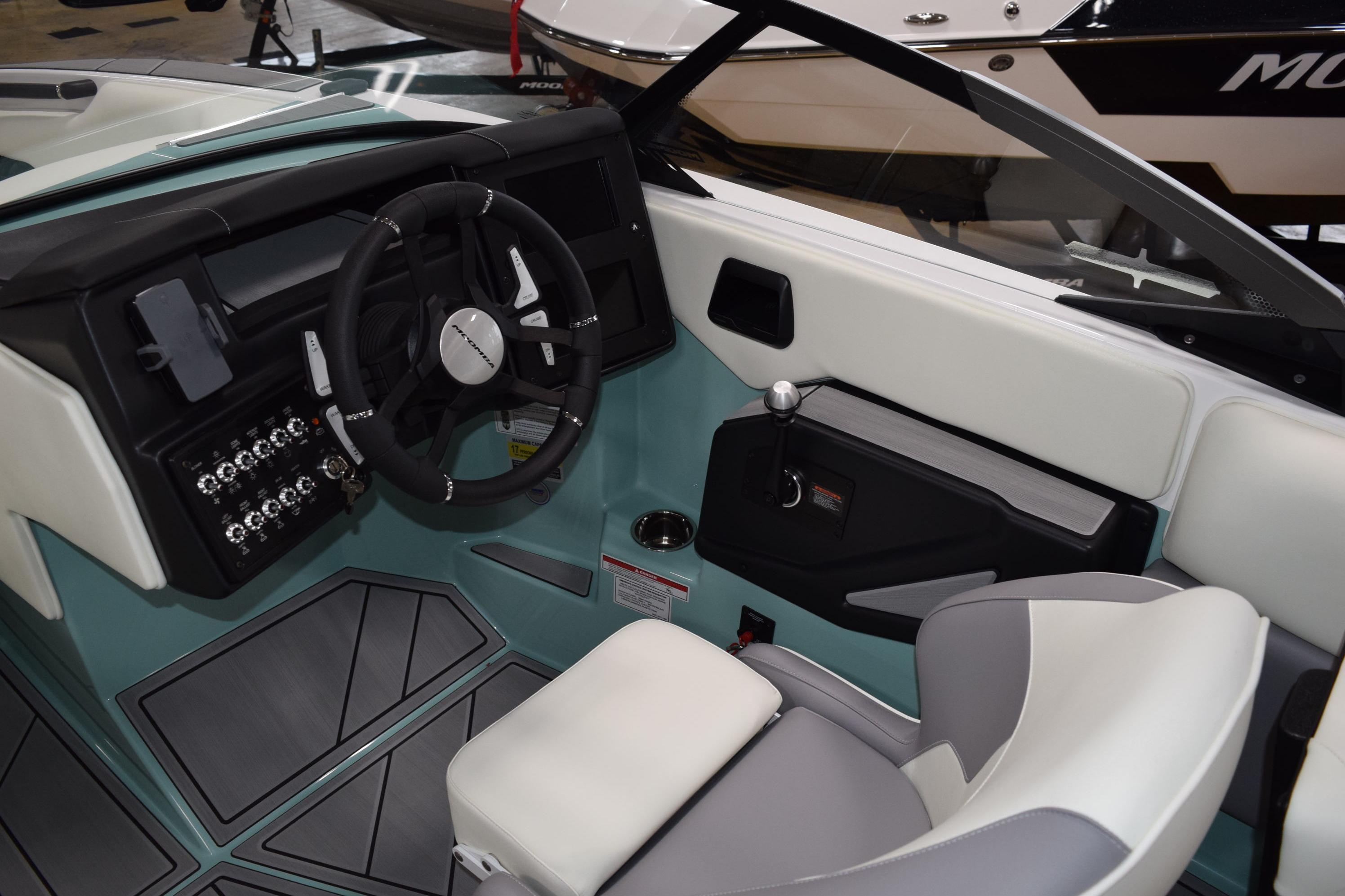 2025 Moomba Mojo boat interior with modern dashboard and steering wheel design.