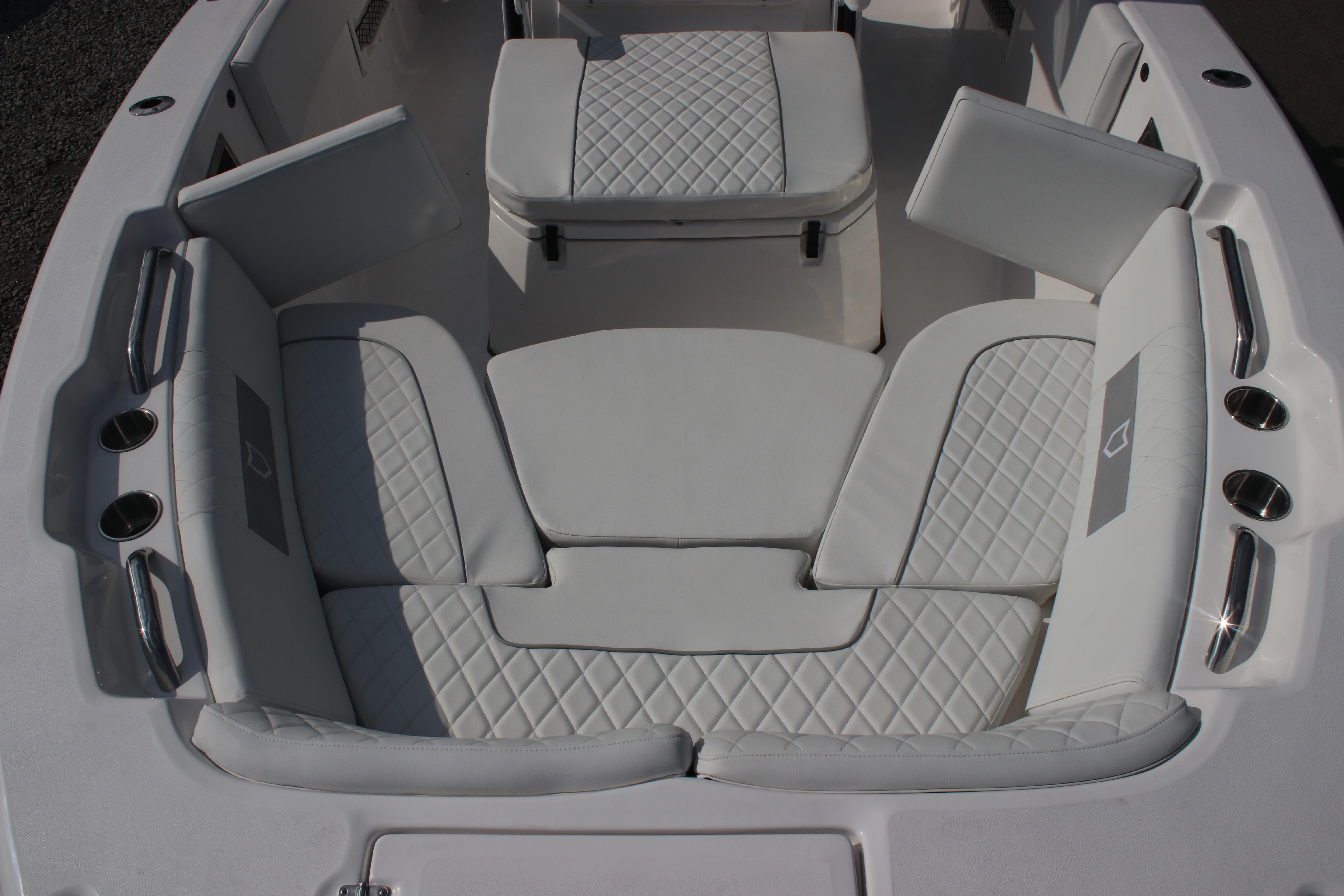 Luxurious seating area on 2026 Sea Fox 268 Commander boat with quilted upholstery.